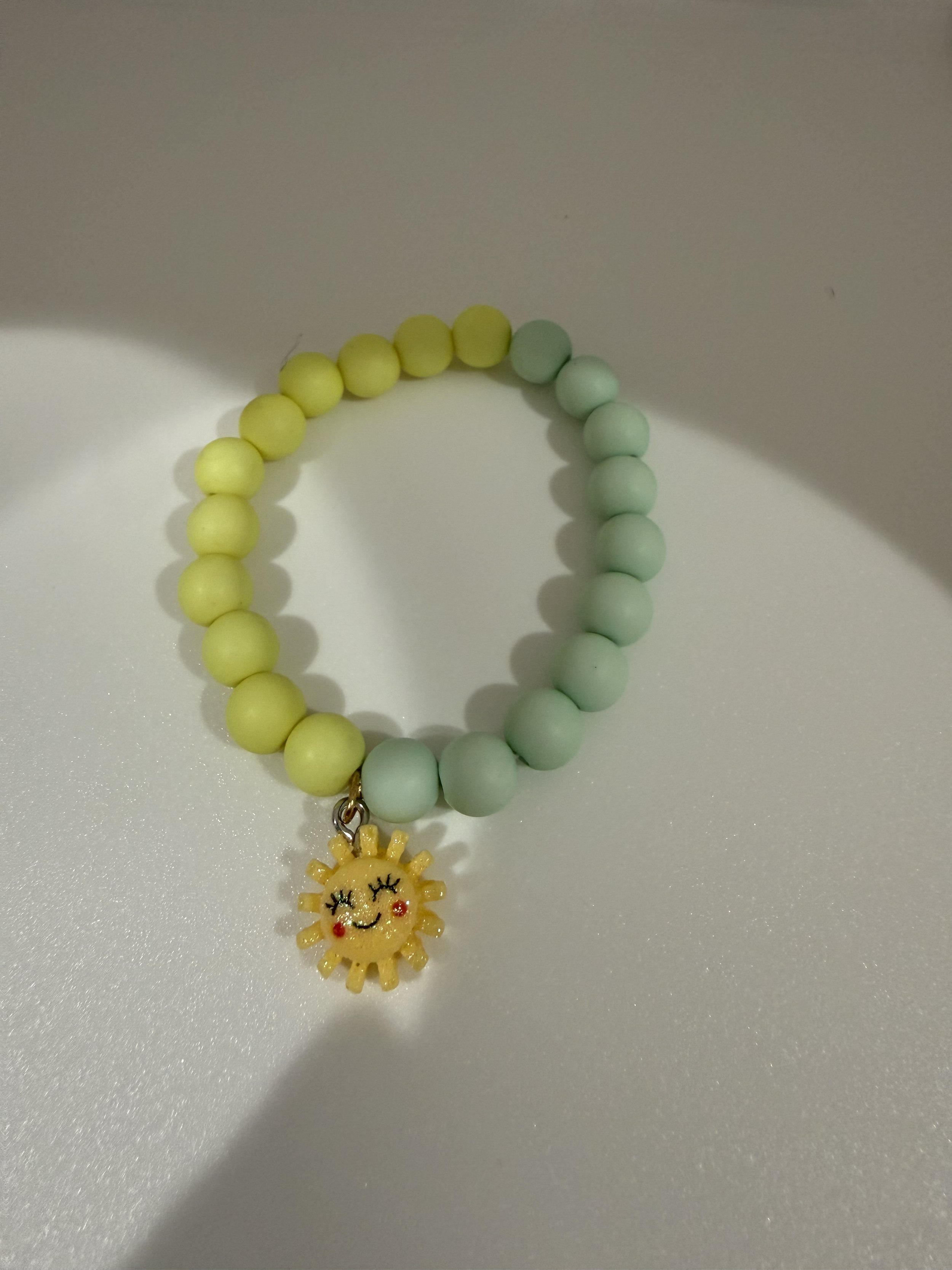 Mint and yellow beaded sun charm bracelet