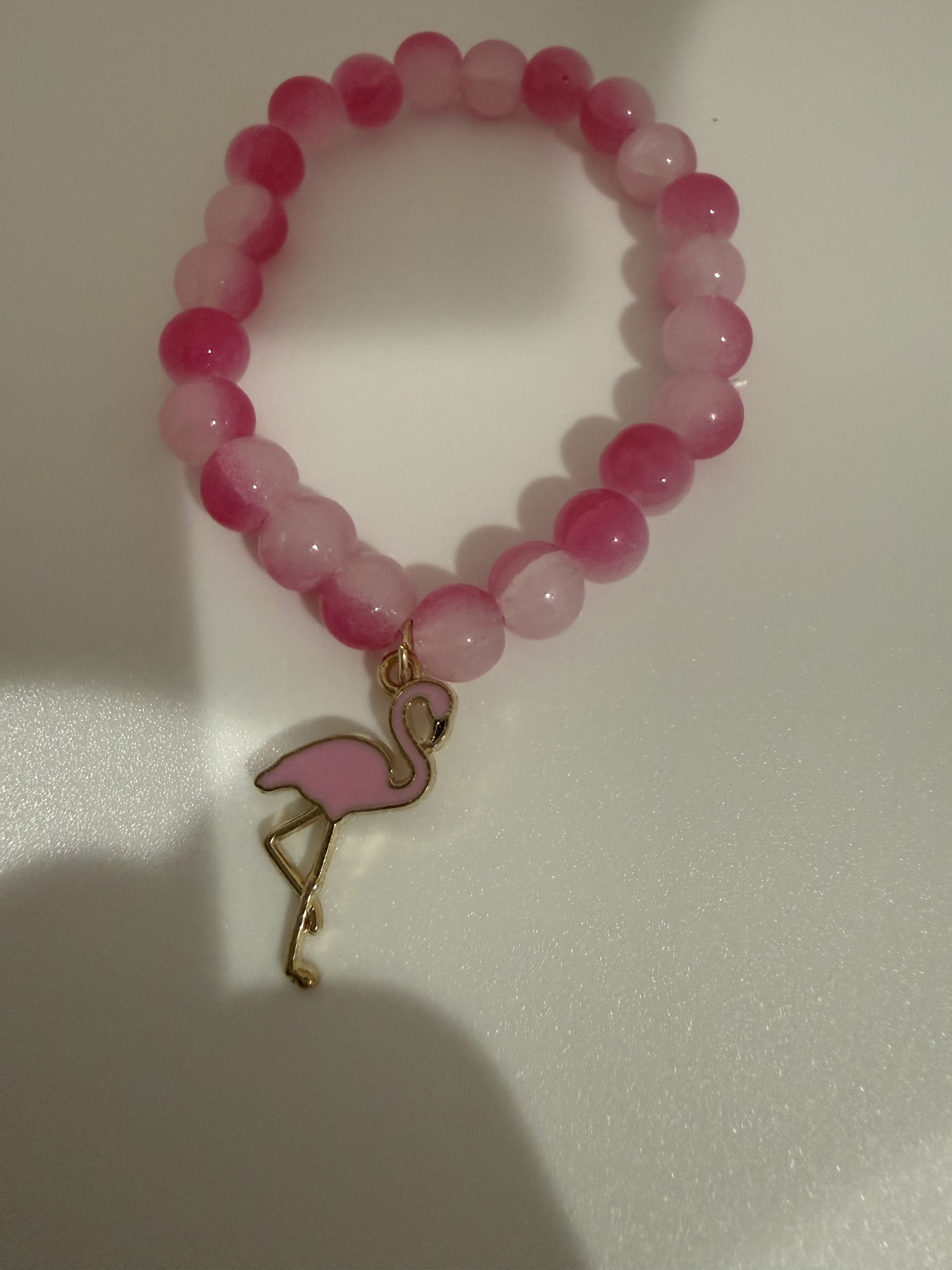 Light and hot pink beaded bracelet with pink flamingo charm