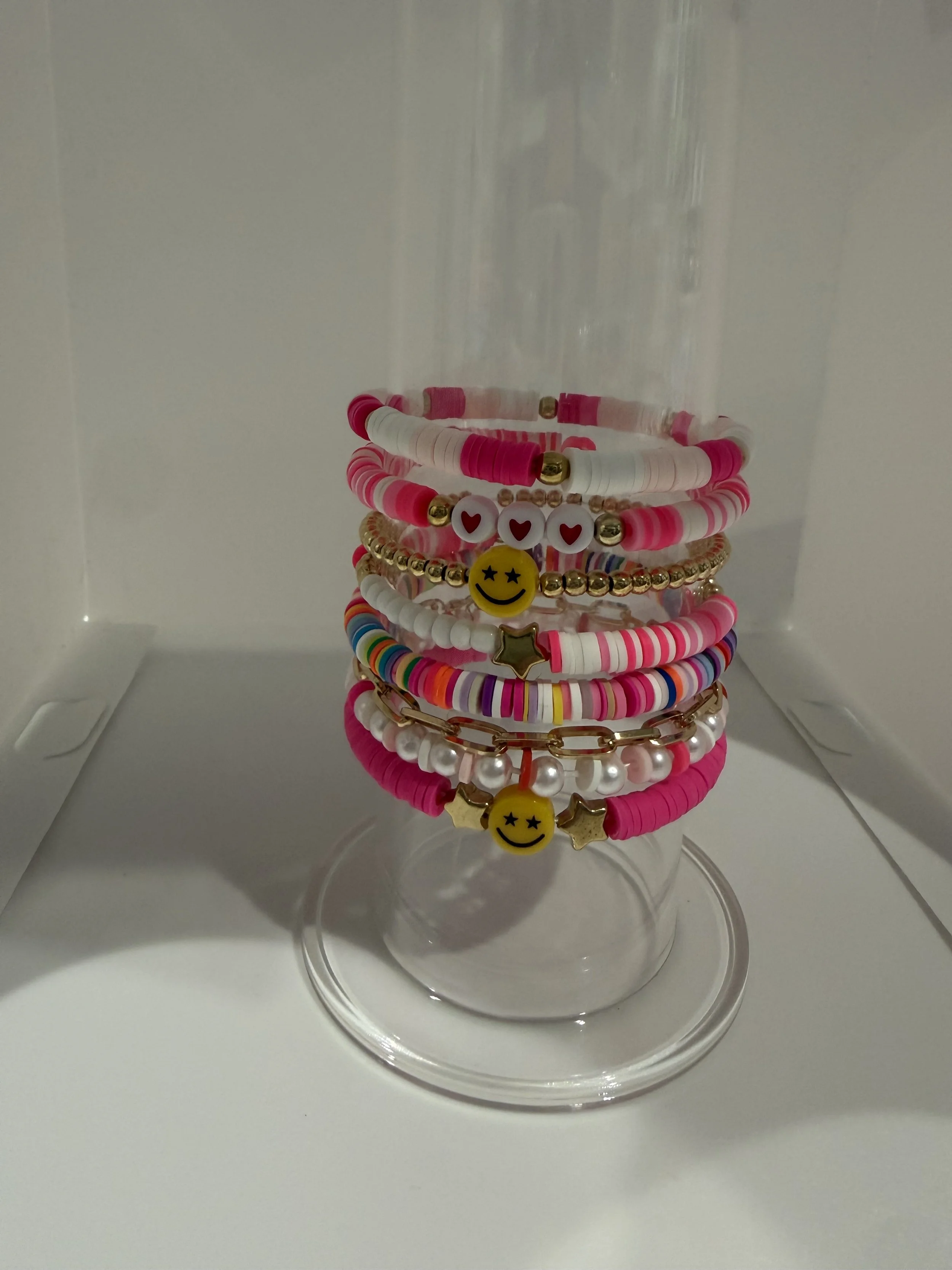Stackable brackets with smiley faces, hearts, and stars
