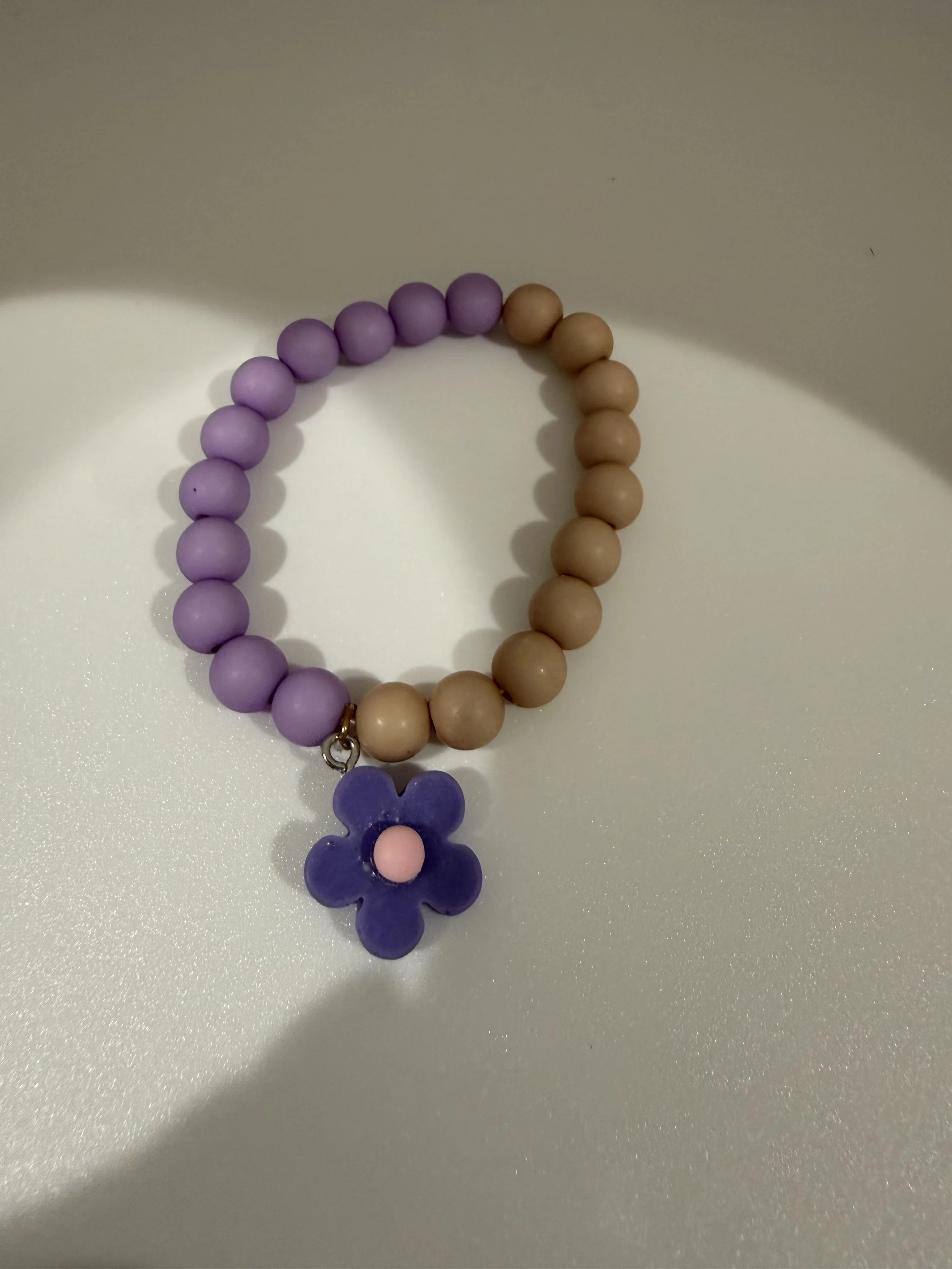 Purple and tan beaded flower bracelet