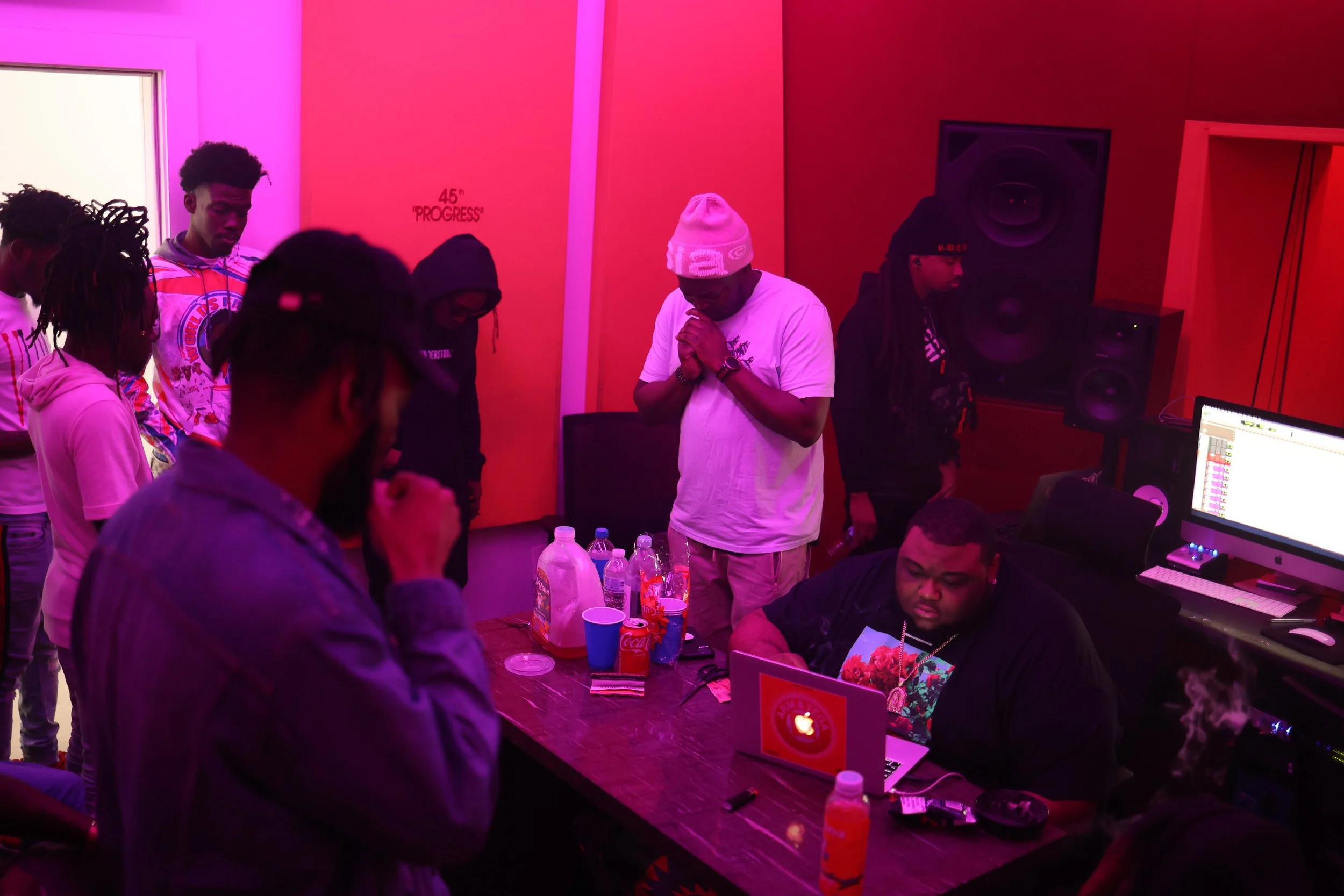 Independent artists and producers collaborating during an immersive studio session, capturing the energy of a creative camp focused on music creation and community.