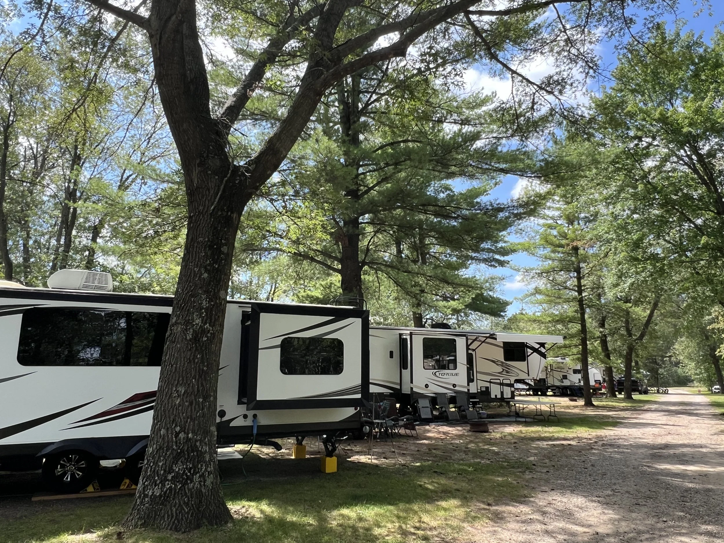 Large campers with slide outs in the trees