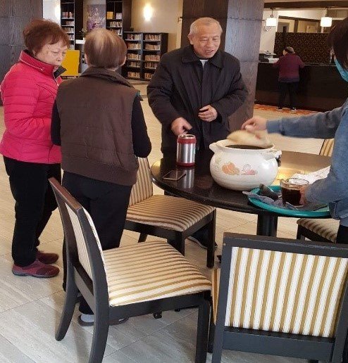 Distributing Chinese traditional herbal soup to Senior Homes