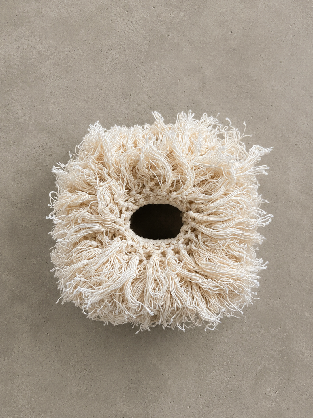 Handcrafted fringe tissue box cover in Undone Muslin designed for standard cube tissue boxes.