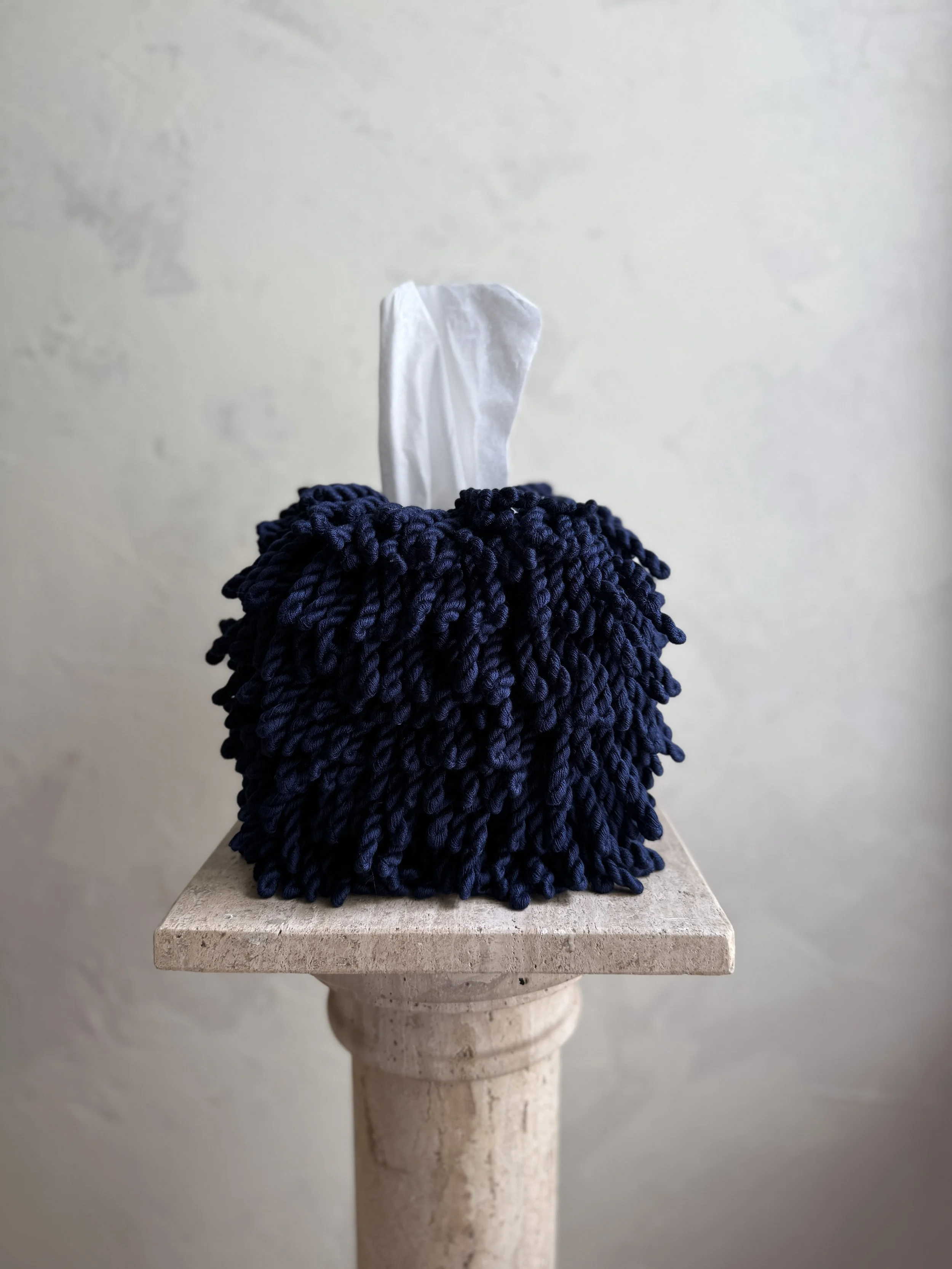 Midnight Blue Fringe Tissue Box Cover with hand-twisted fringe detailing on pedestal, designed by Amber Renee Hansen.