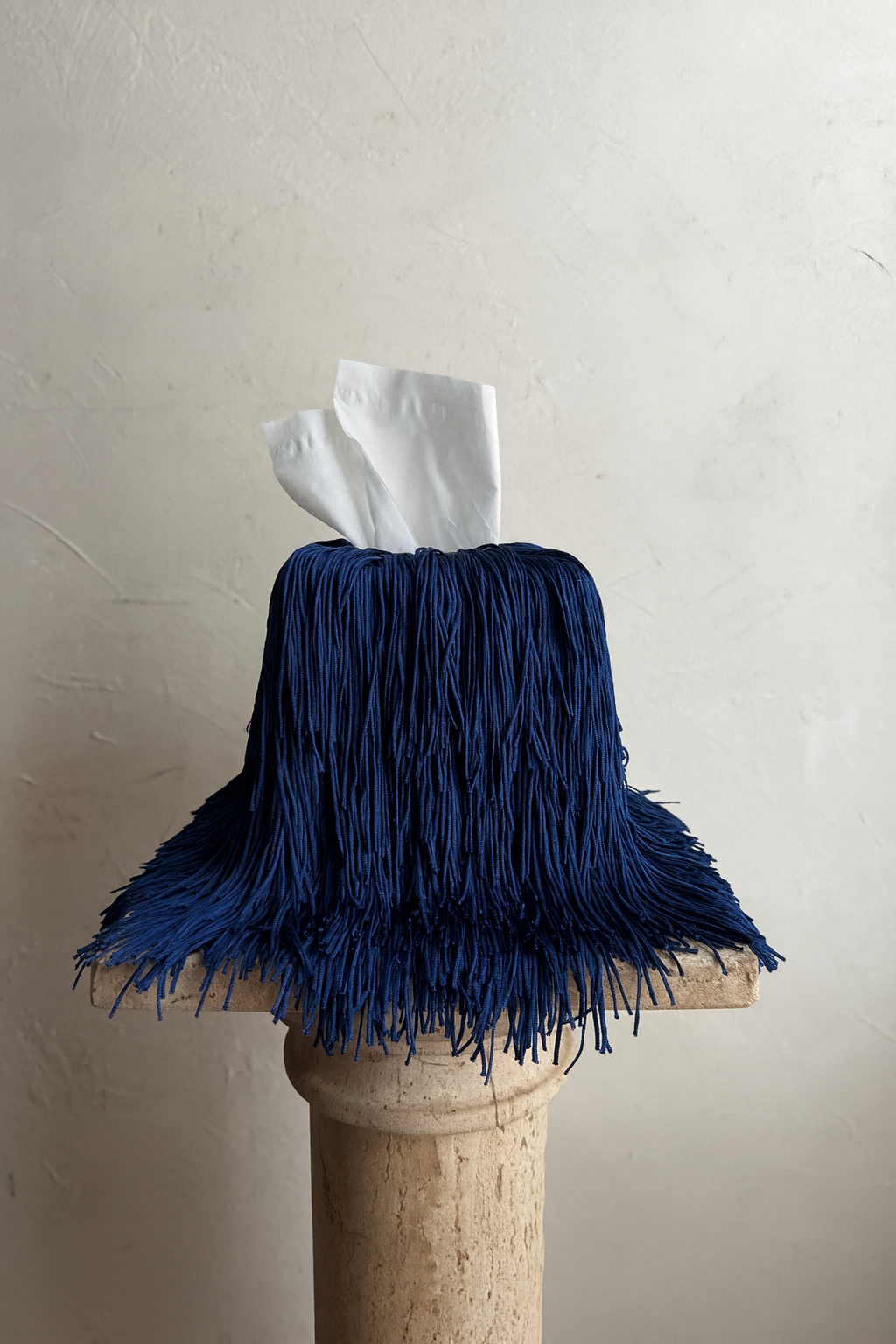 Fringe tissue cover in cobalt blue, a quiet luxury accent from Amber Renee Hansen’s Spill Edit.