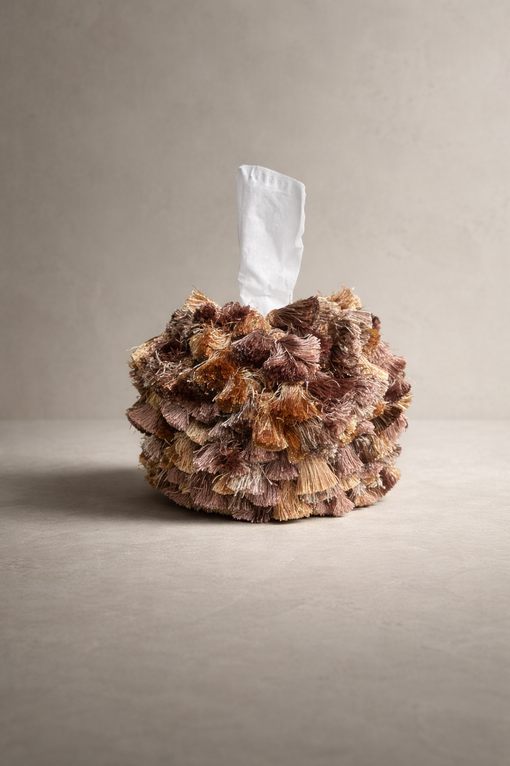 Rosé dune tassel tissue box cover with layered blush, taupe, and golden sand tones