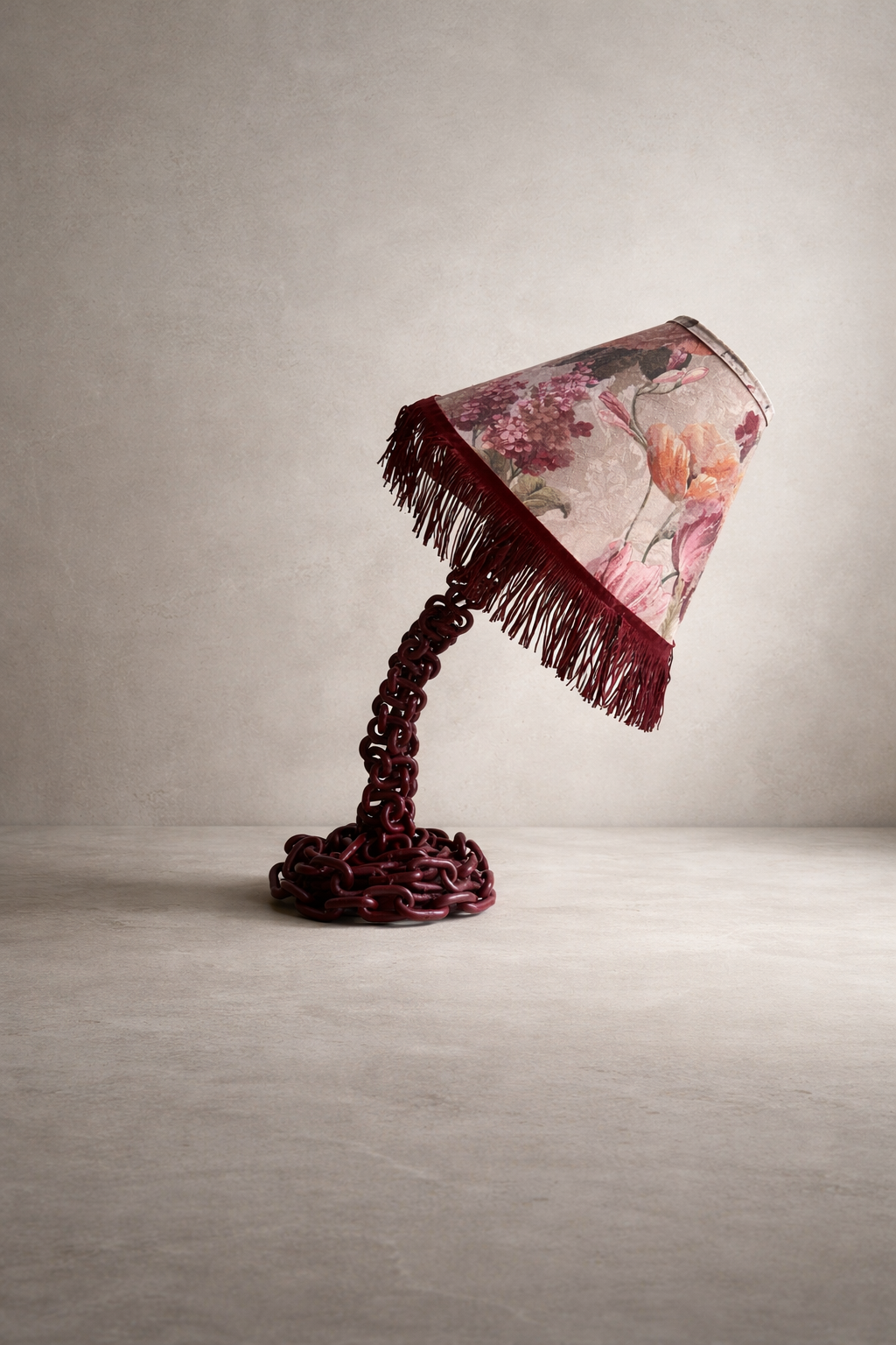 Offset Chain Table Lamp in Merlot with fringe trim along the bottom edge of the shade, bent in an offset position