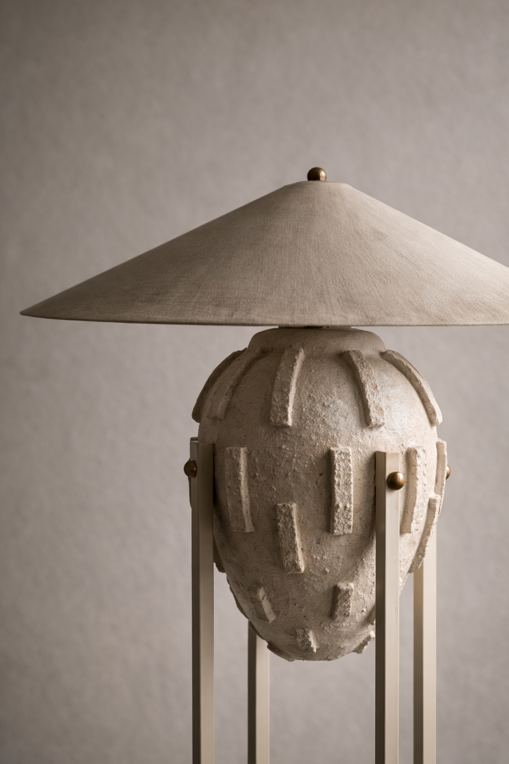 Amphora Floor Lamp from the Elongated Collection — sculptural floor lamp with textured vessel base, metal shade, and minimalist stand.