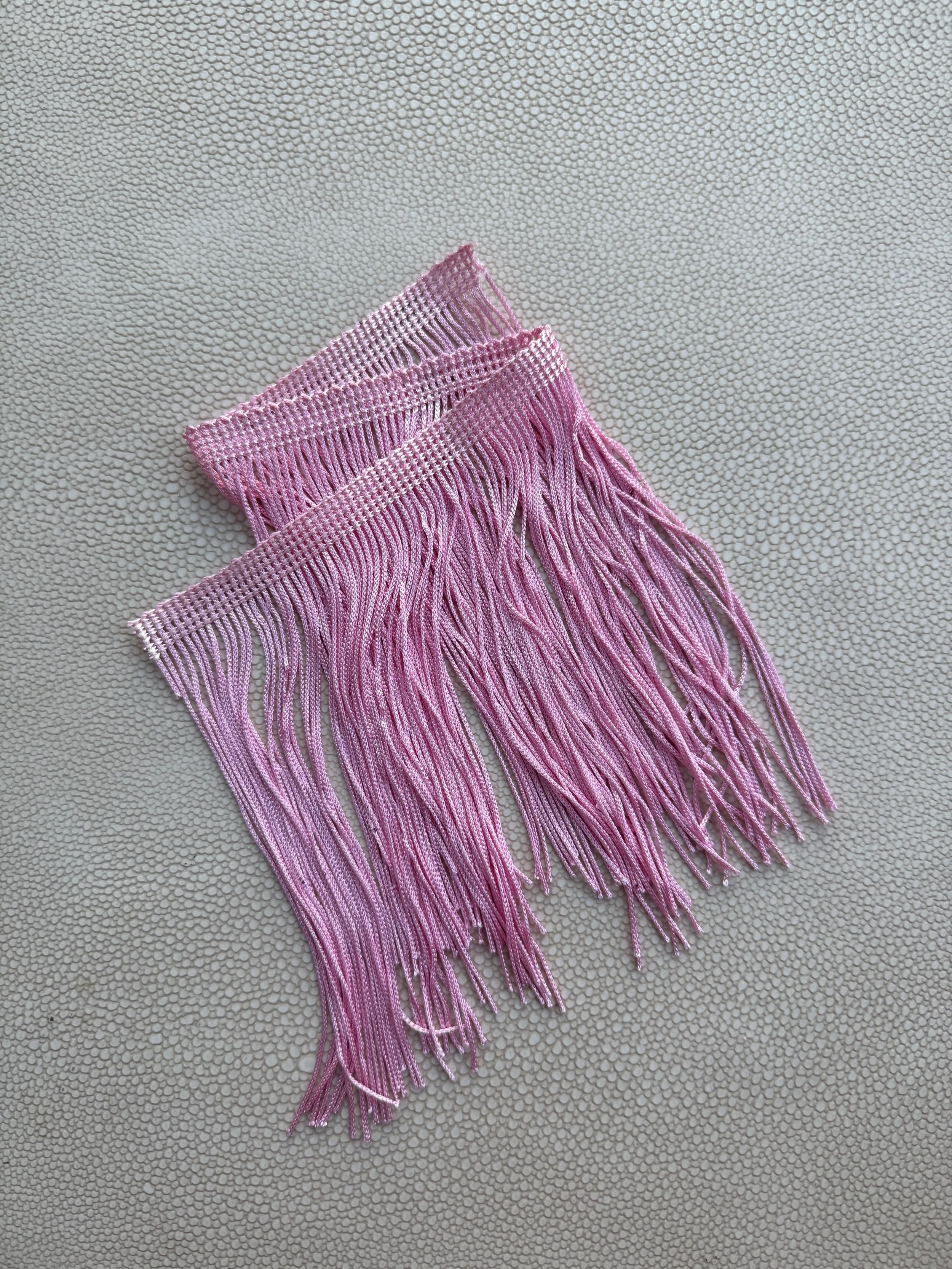 Pink in Motion fringe tissue box cover from the Spill Edit, hand-wrapped in soft blush fringe.