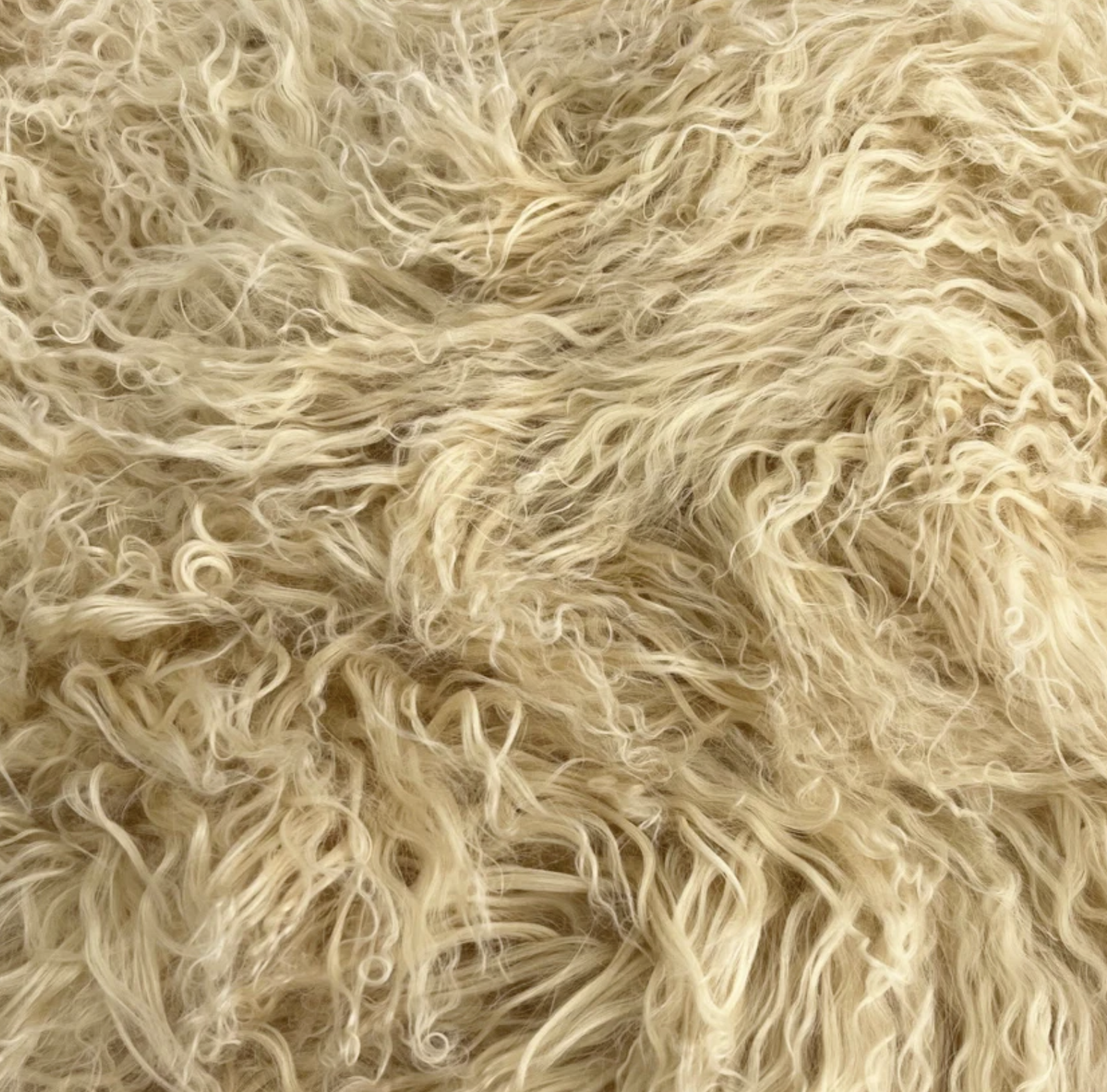 Close-up detail of 100% genuine Mongolian lamb fur in Bone Cream colorway