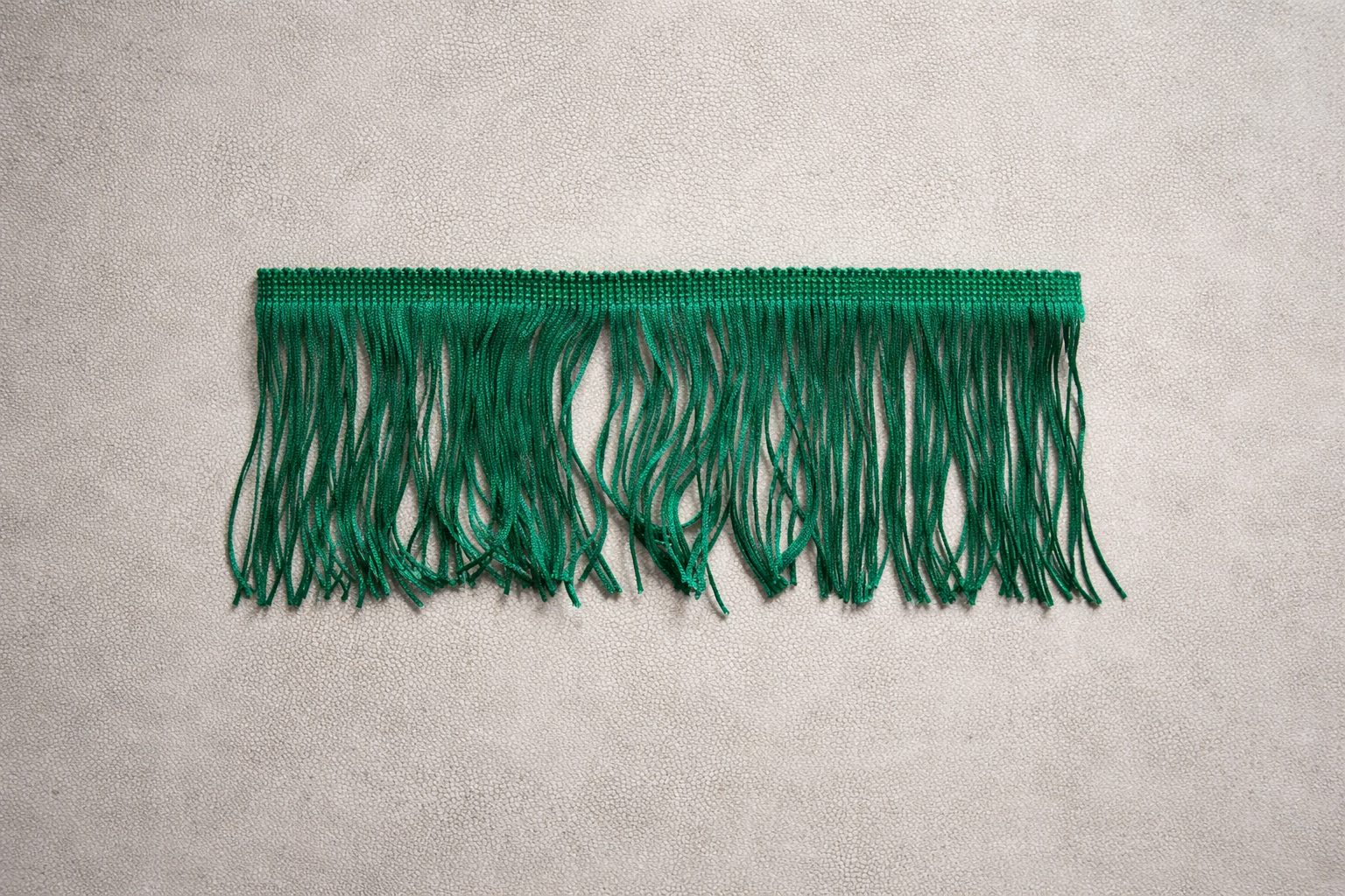 Studio Green fringe tissue box cover Spill Edit with refined sheen and controlled texture photographed in a minimal editorial studio setting