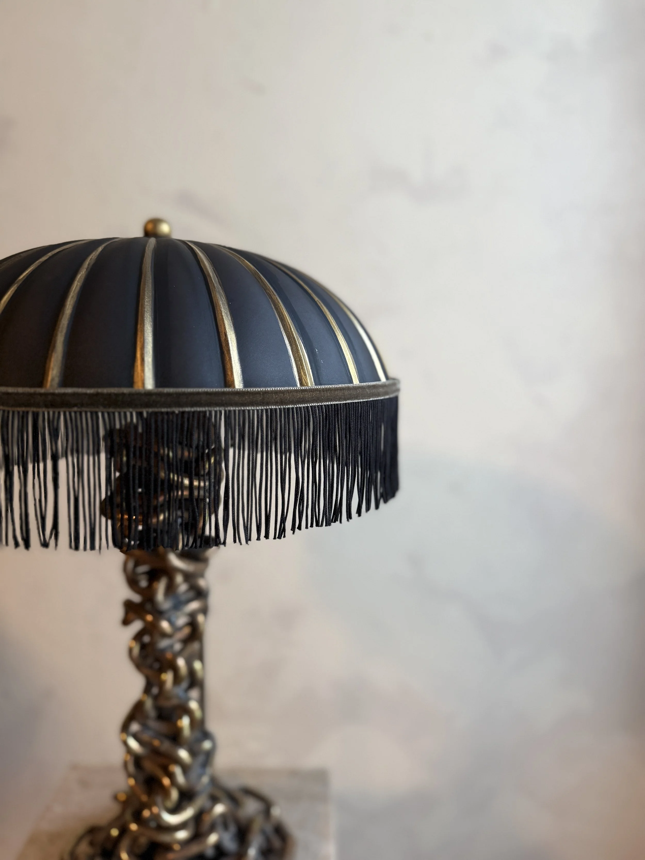 Umbra Chain Lamp with hand-painted glass shade, fringe trim, and lichen stone velvet detailing