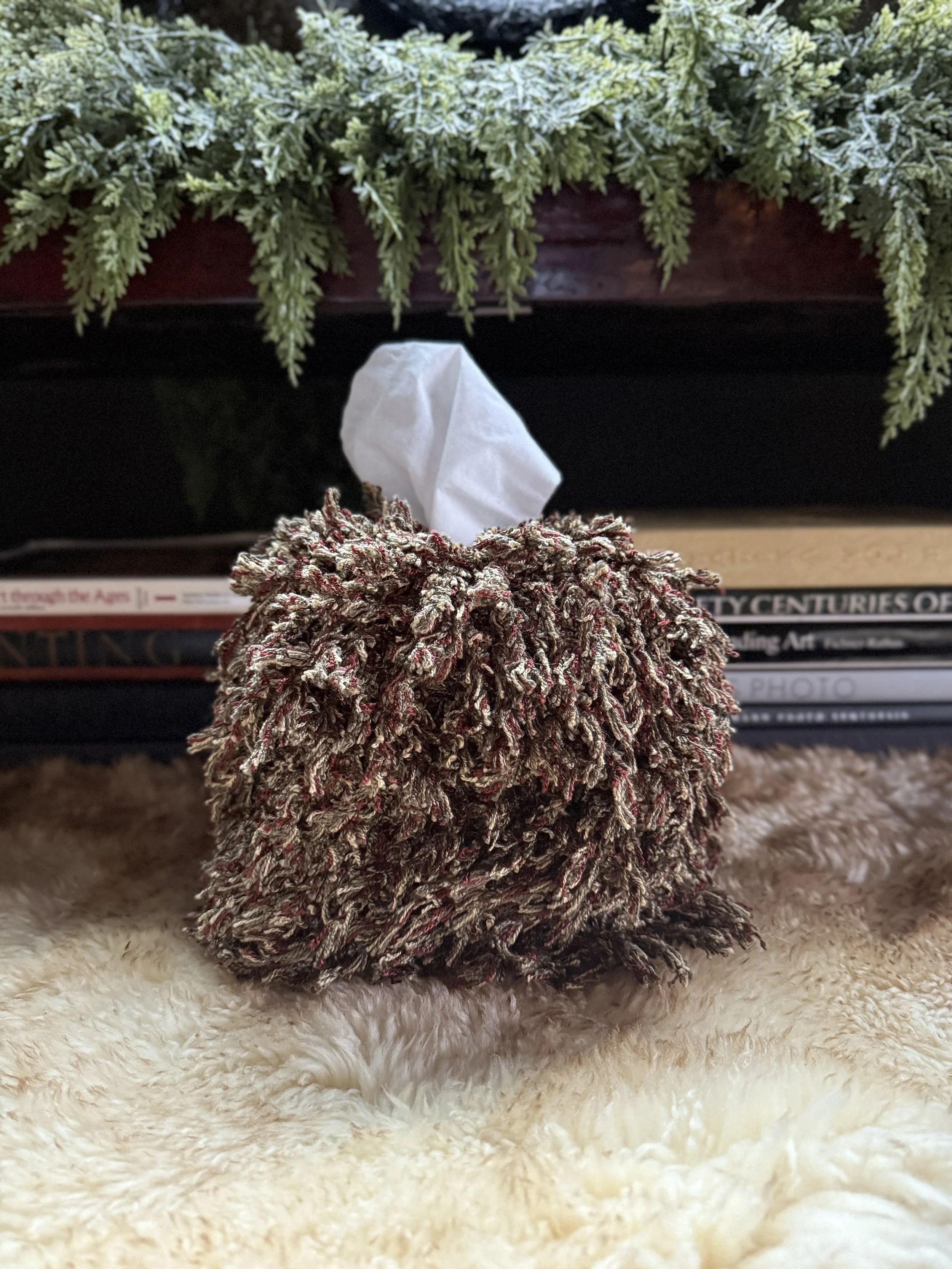 Seaweed Merlot fringe tissue box cover — sculptural home object wrapped in mossy olive and deep merlot tones with subtle cream threading