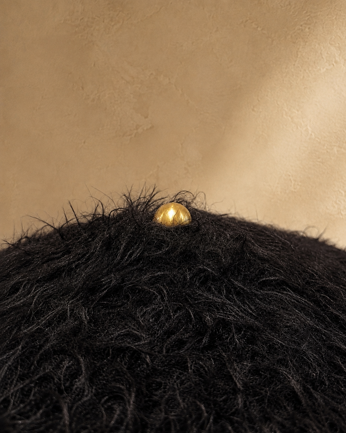 Triphora sculptural table lamp by Amber Renee Hansen with a deep brown faux fur amphora form and wide faux fur shade, black tripod frame, and wrapped cord detail.