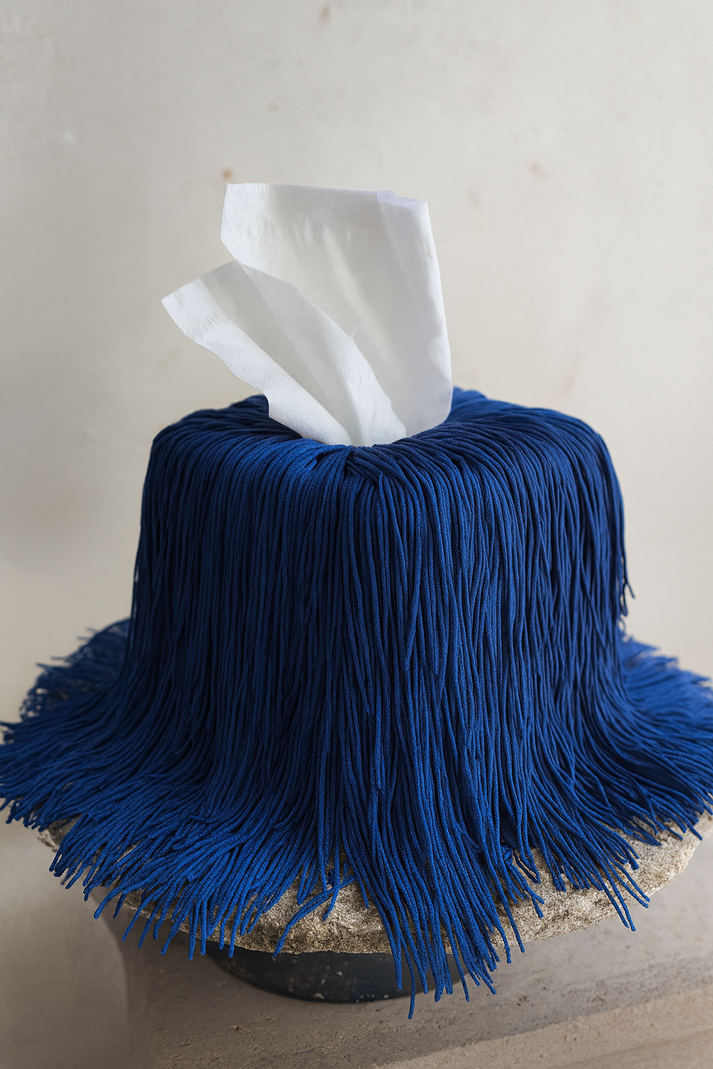 Editorial cobalt blue fringe tissue box cover – minimal yet bold design detail.