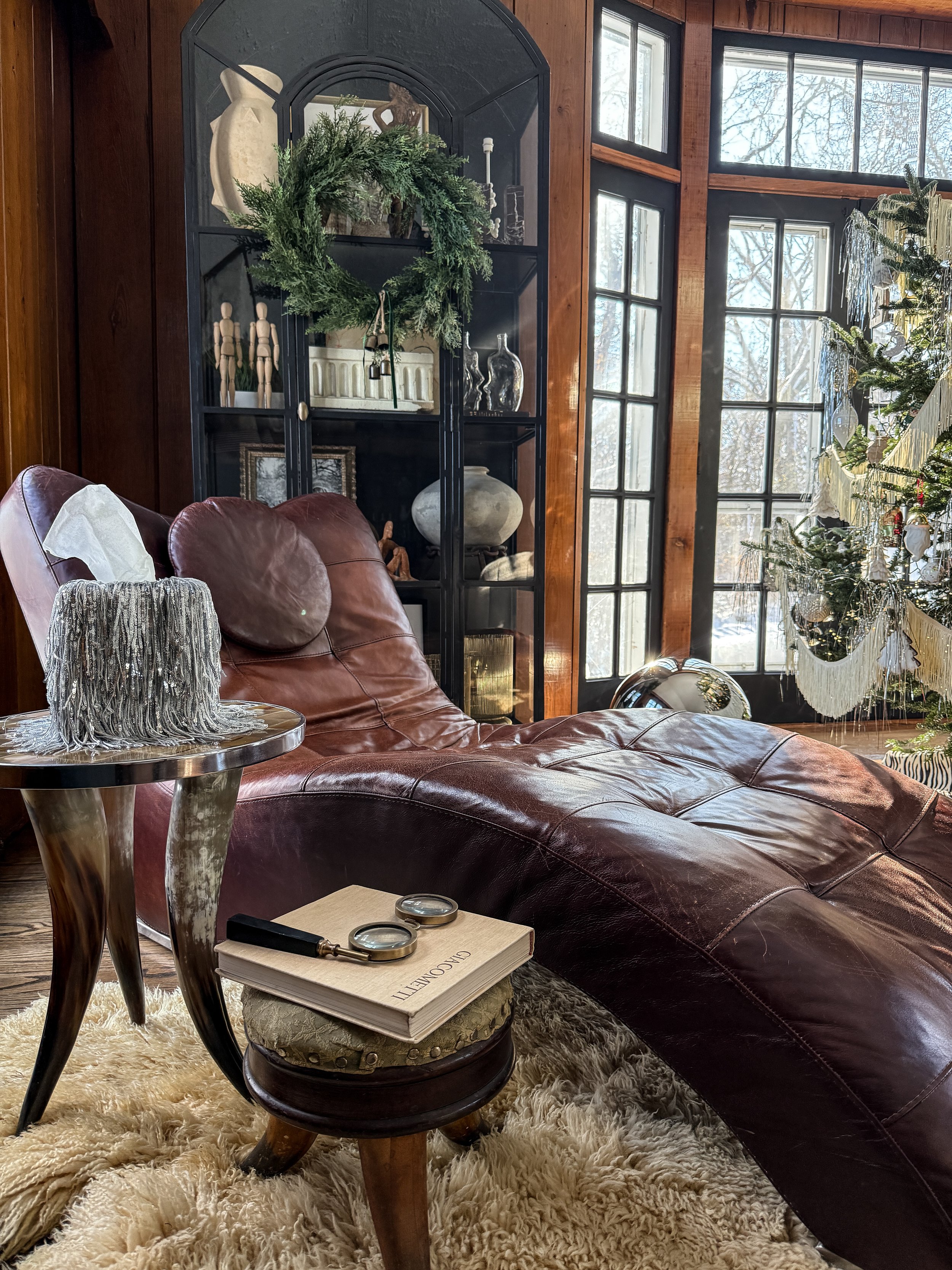 IMG_3376.JPGLuxury silver fringe tissue box cover with dramatic cascading strands illuminated in natural light, creating a high-end, editorial home décor moment.