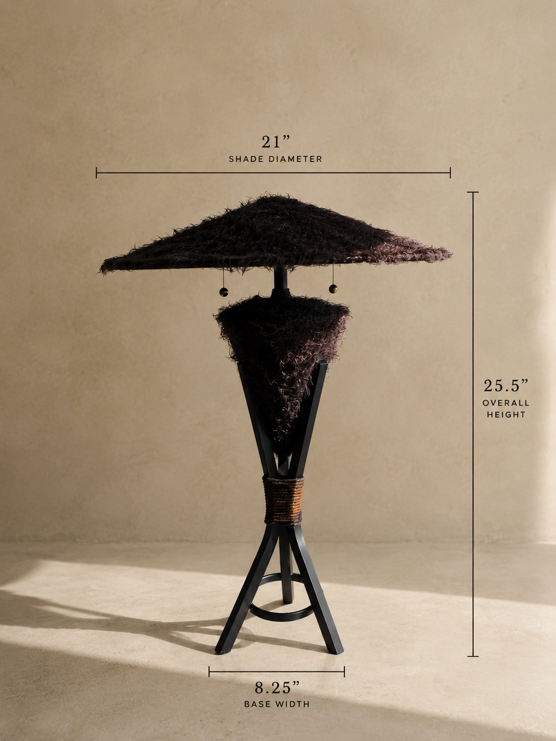 Triphora sculptural table lamp by Amber Renee Hansen with a deep brown faux fur amphora form and wide faux fur shade, black tripod frame, and wrapped cord detail.