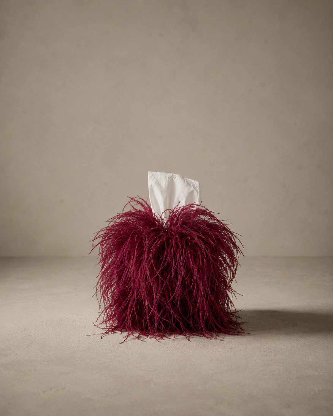Luxury burgundy ostrich feather tissue box cover with genuine ostrich feathers.