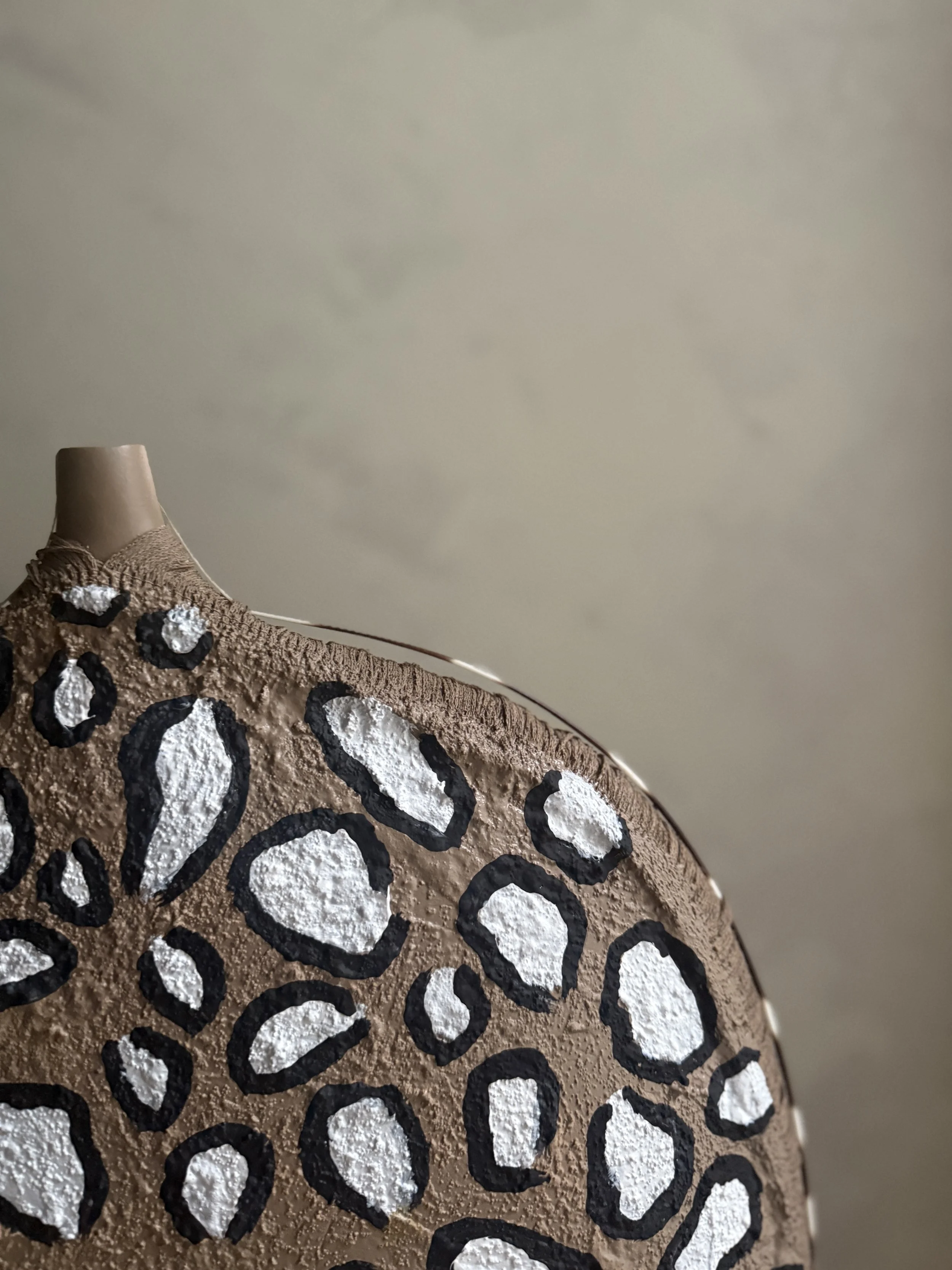 Fringe Discipline vessel by Amber Renee Hansen — cement-coated ceramic form with embedded fringe and porcupine quills, part of the Untamed Collection.