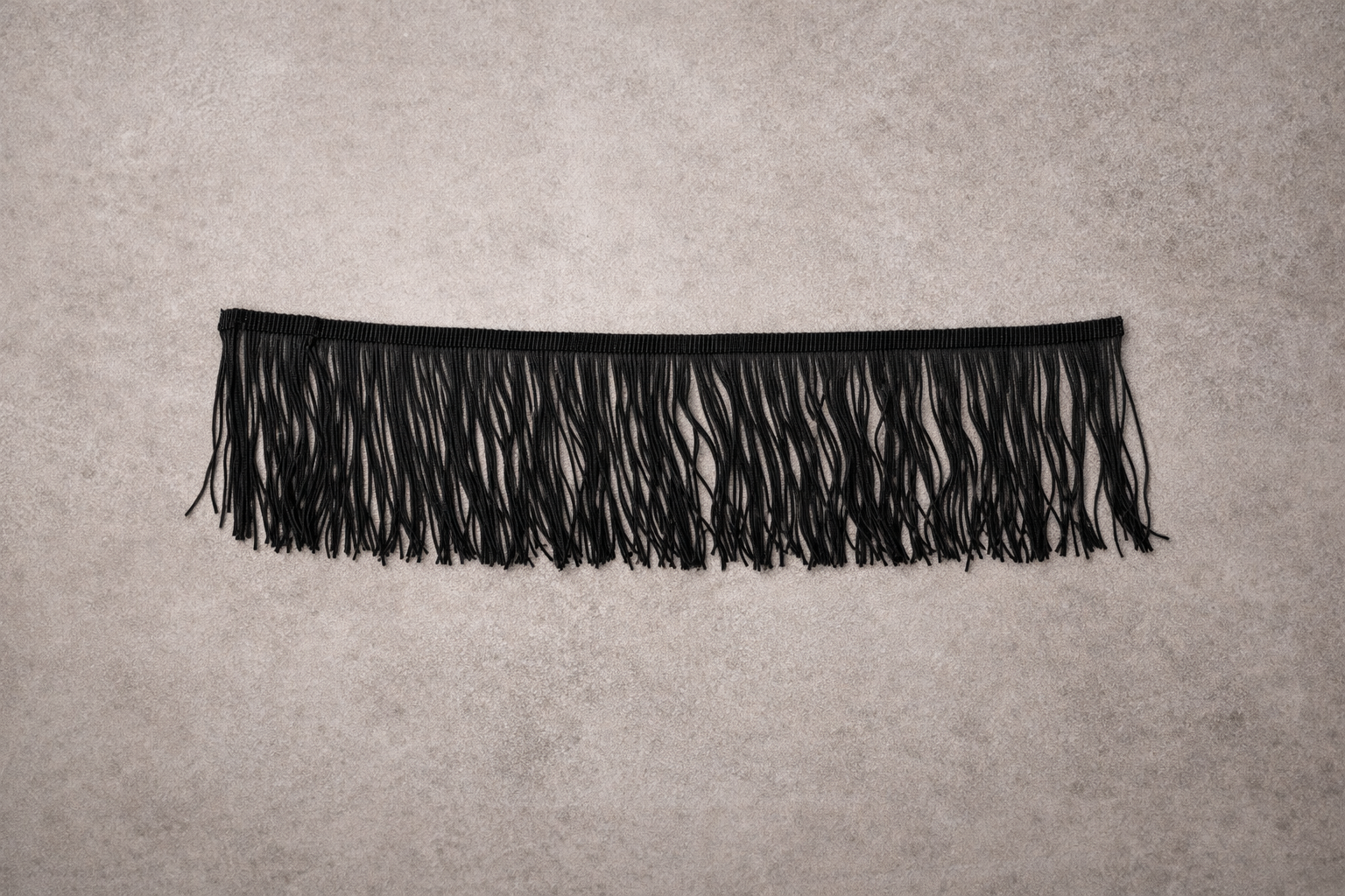 Close up of black fringe for Fringe Tissue Box Cover spill edit by Amber Renee Hansen