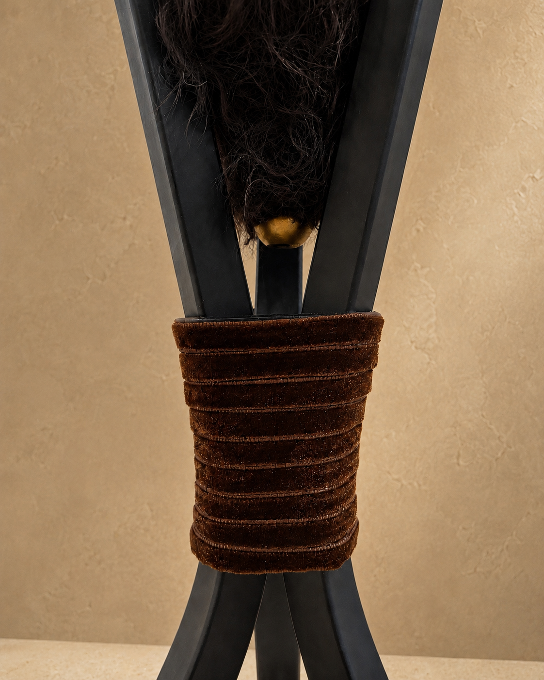 Triphora sculptural table lamp by Amber Renee Hansen with a deep brown faux fur amphora form and wide faux fur shade, black tripod frame, and wrapped cord detail.