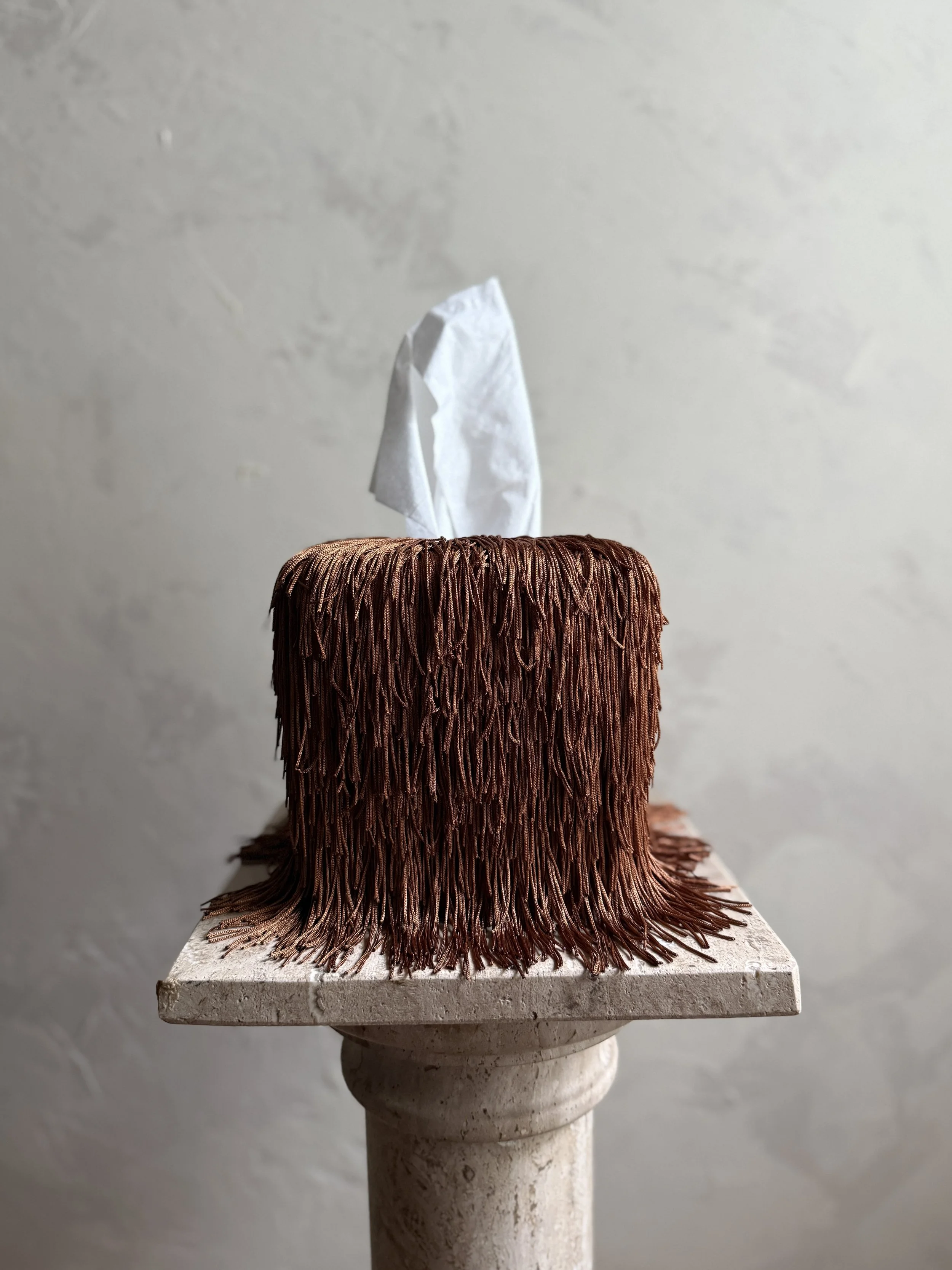 Close-up of Cayenne fringe texture with refined sheen and sculptural spill effect