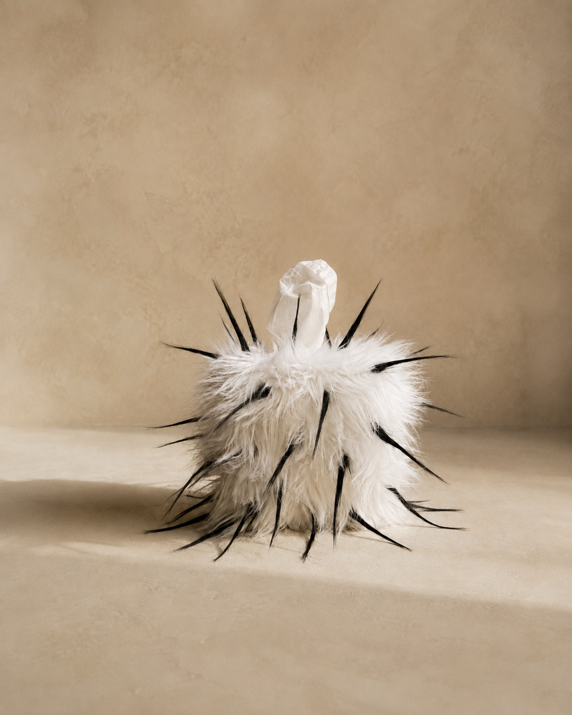 Quiet Thorn faux fur tissue box cover with fibers styled upward to create an exaggerated pointed texture.