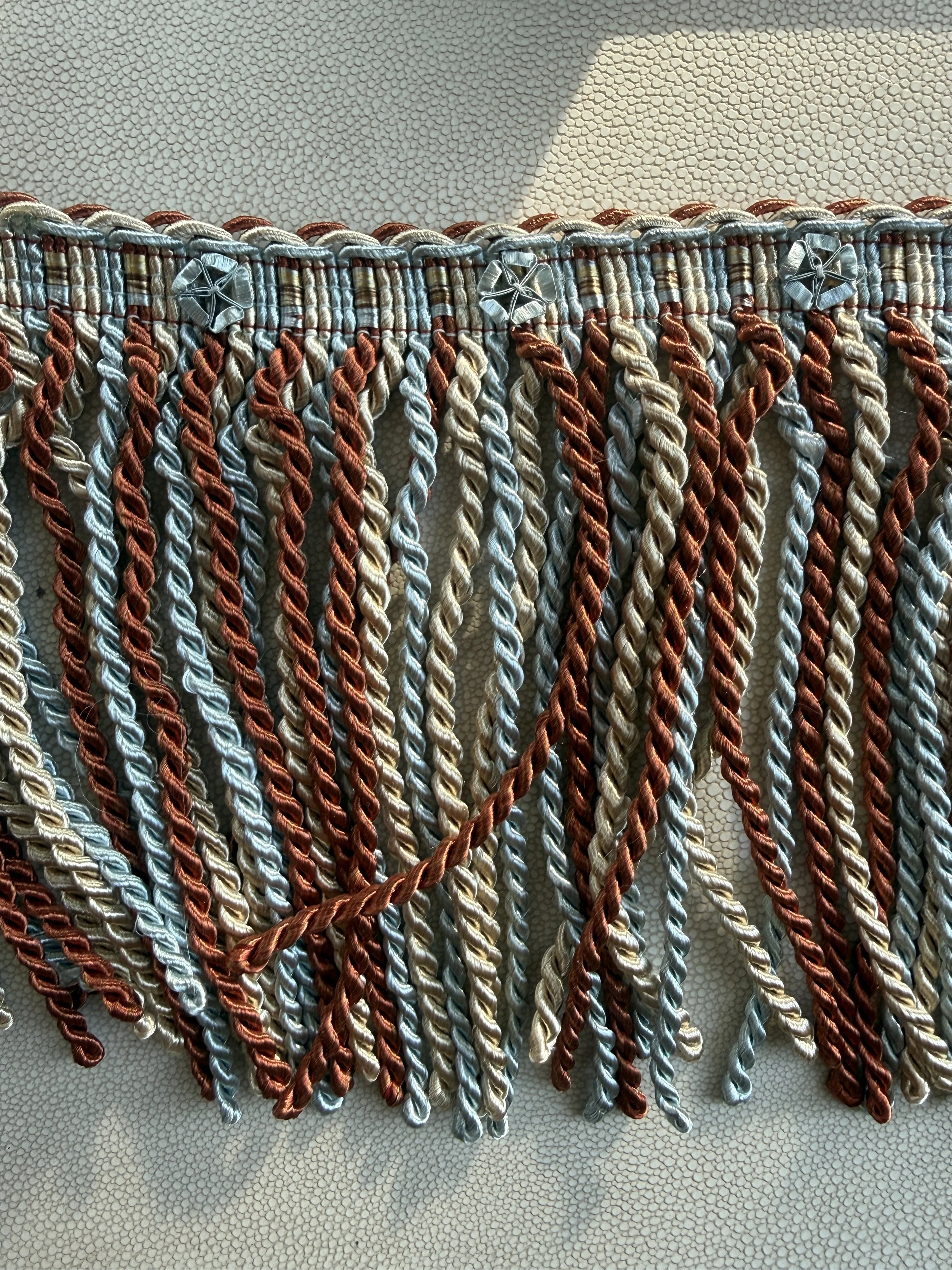 Canyon Sky fringe tissue box cover in cayenne, soft blue, and cream tones with layered fringe texture