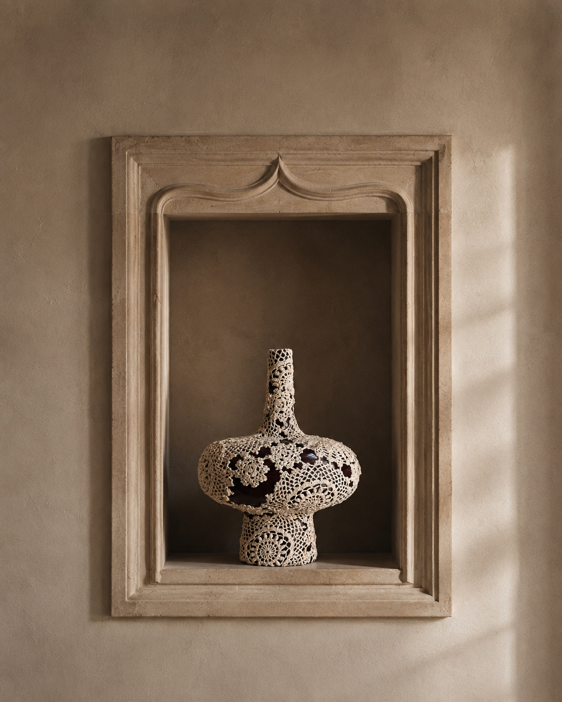 Veil Vessel by Amber Renee Hansen, a deep brown ceramic vessel wrapped in warm ivory vintage hand-crocheted lace.