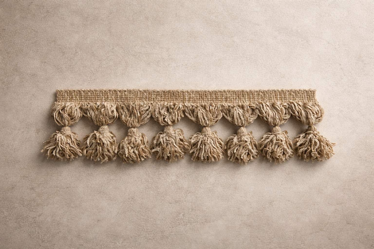 Soft neutral tassel fringe tissue box cover in warm tumbled clay tone with dense, ultra-soft texture, designed by Amber Renee Hansen.