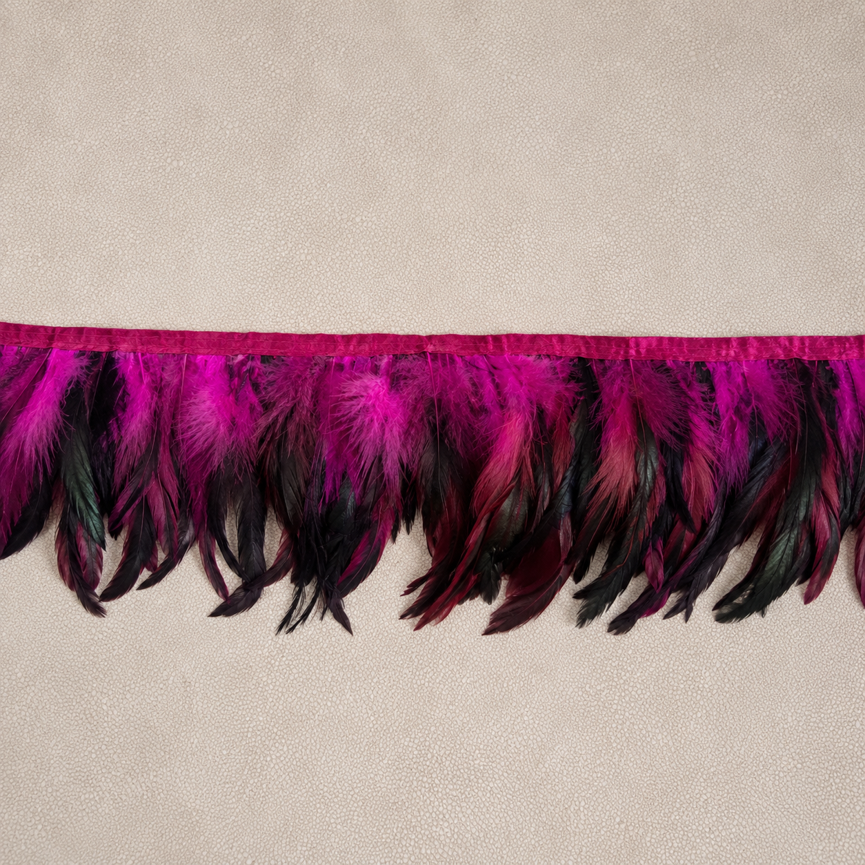 Luxury feather tissue box cover designed by Amber Renee Hansen in layered black, merlot, plum, and orchid tones.