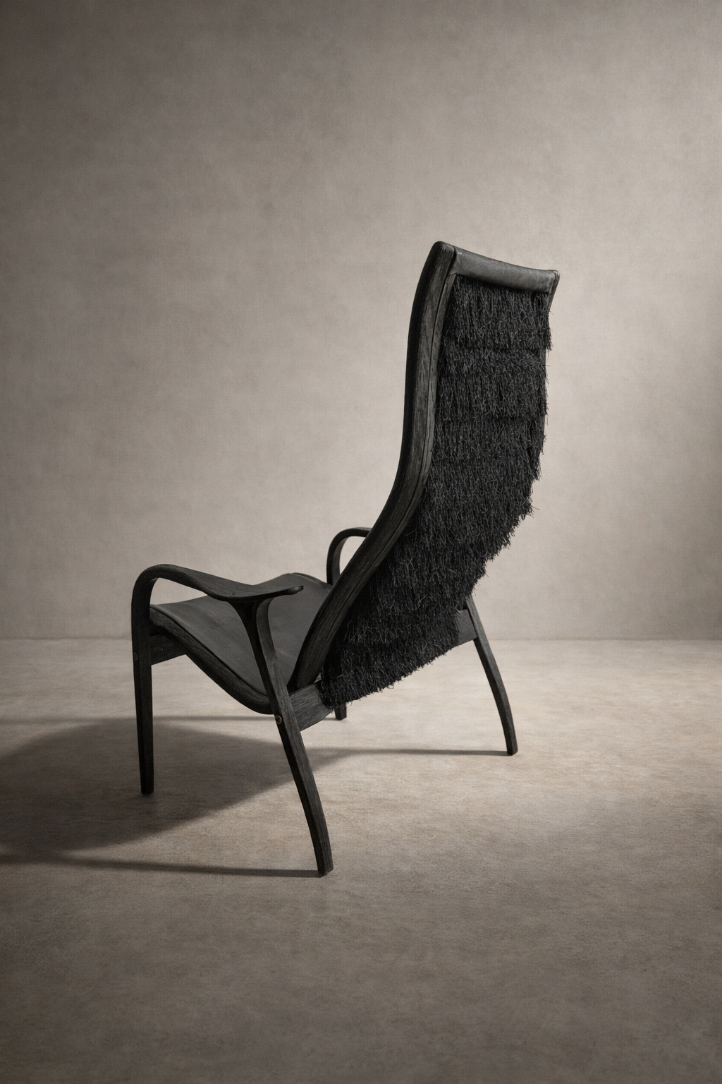 black leather and oak Lamino lounge chair with fringe back