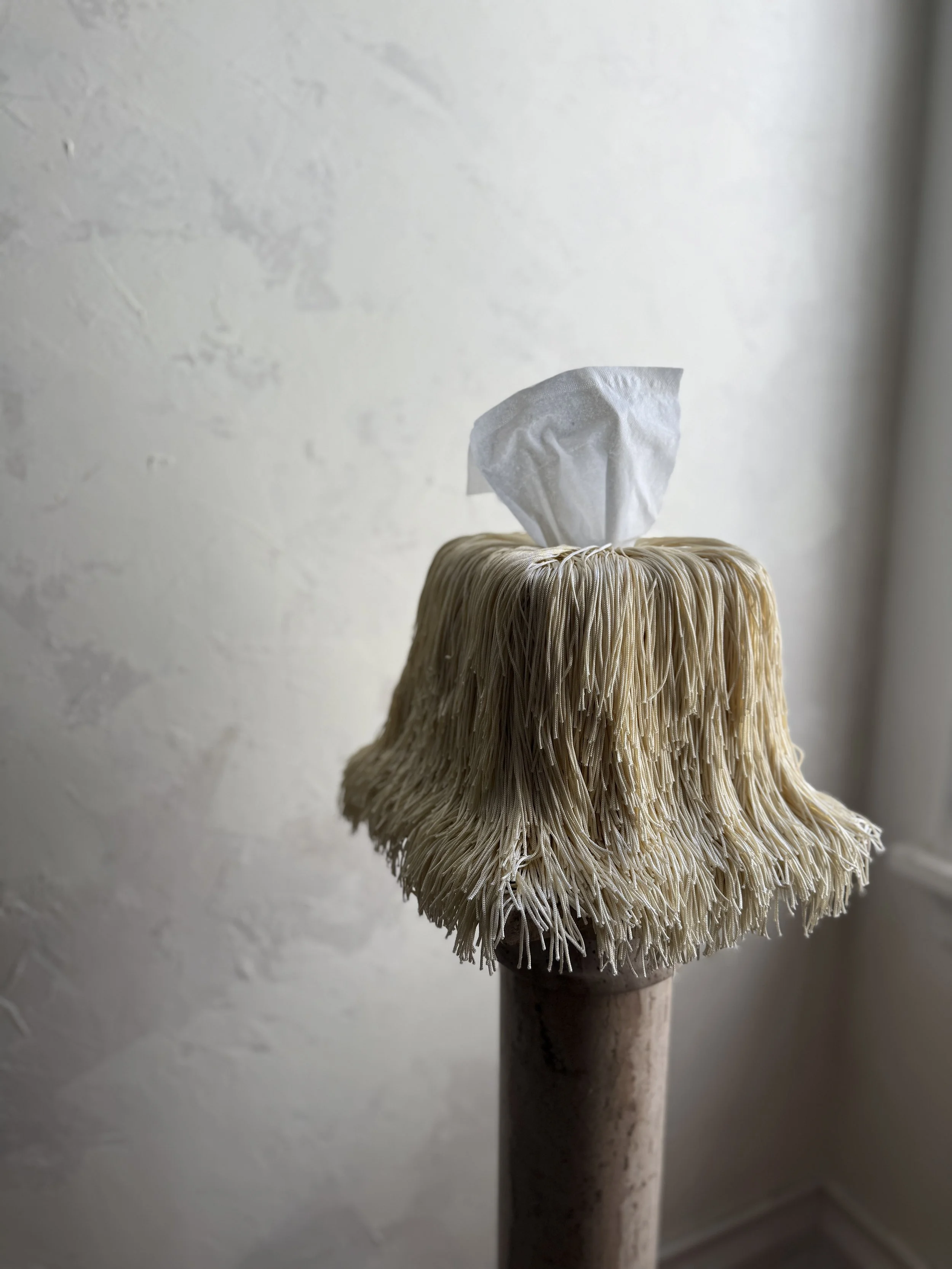 Ivory Fringe Tissue Box Cover — Spill Edit by Amber Renee Hansen, featuring tonal ivory fringe that drapes and puddles with soft sheen and sculptural movement.