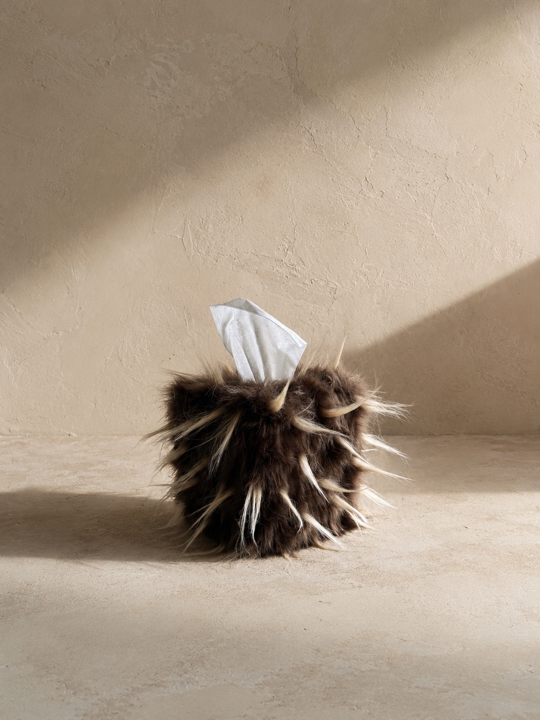 Quiet Thorn faux fur tissue box cover with fibers styled upward to create an exaggerated pointed texture.