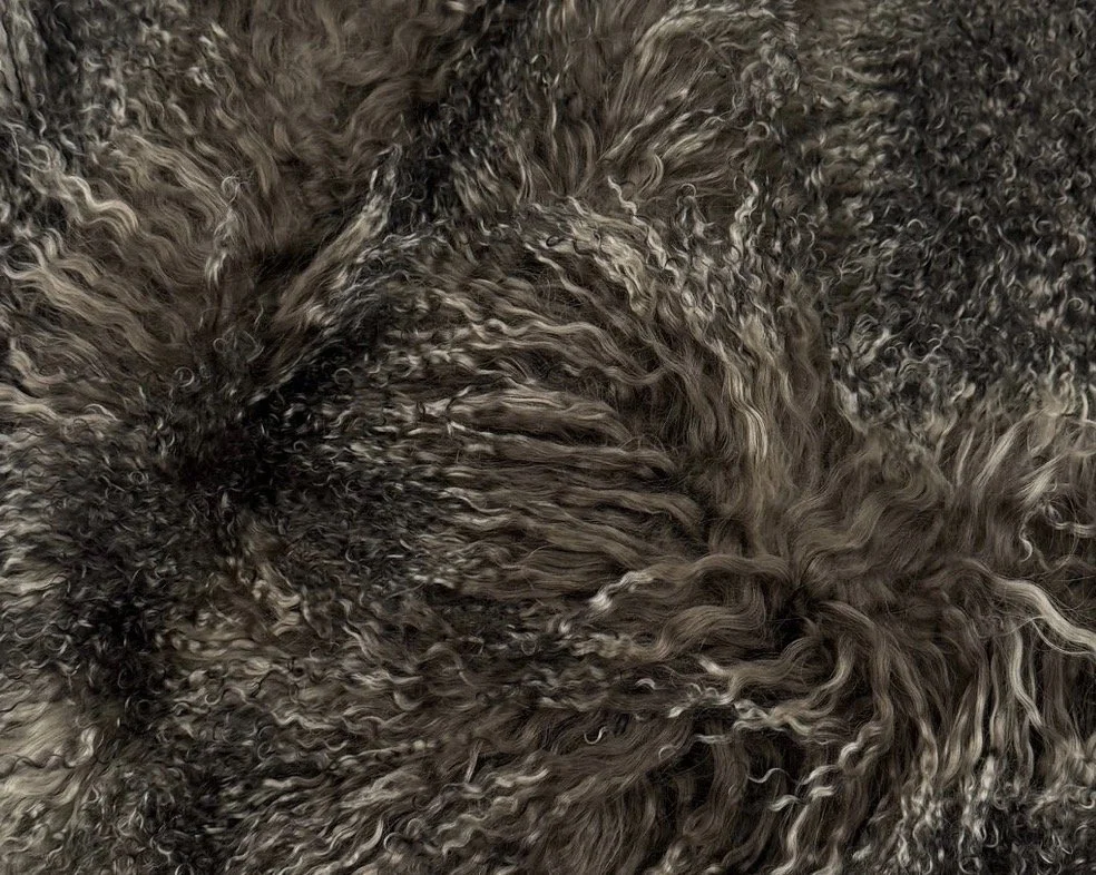 Wing Span Mongolian Lamb Bench in Midnight Moss, featuring a dark espresso metal crossed frame, photographed in a quiet neutral setting