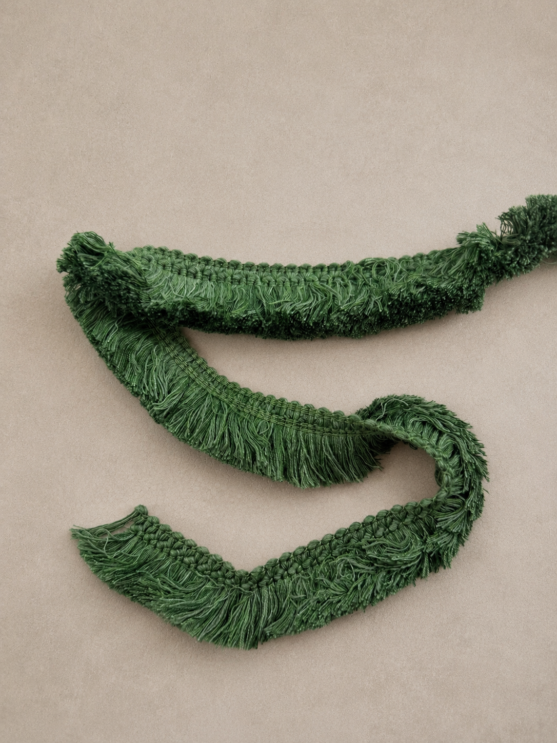 Verde fringe tissue box cover in textured botanical green fringe styled as a sculptural decorative object