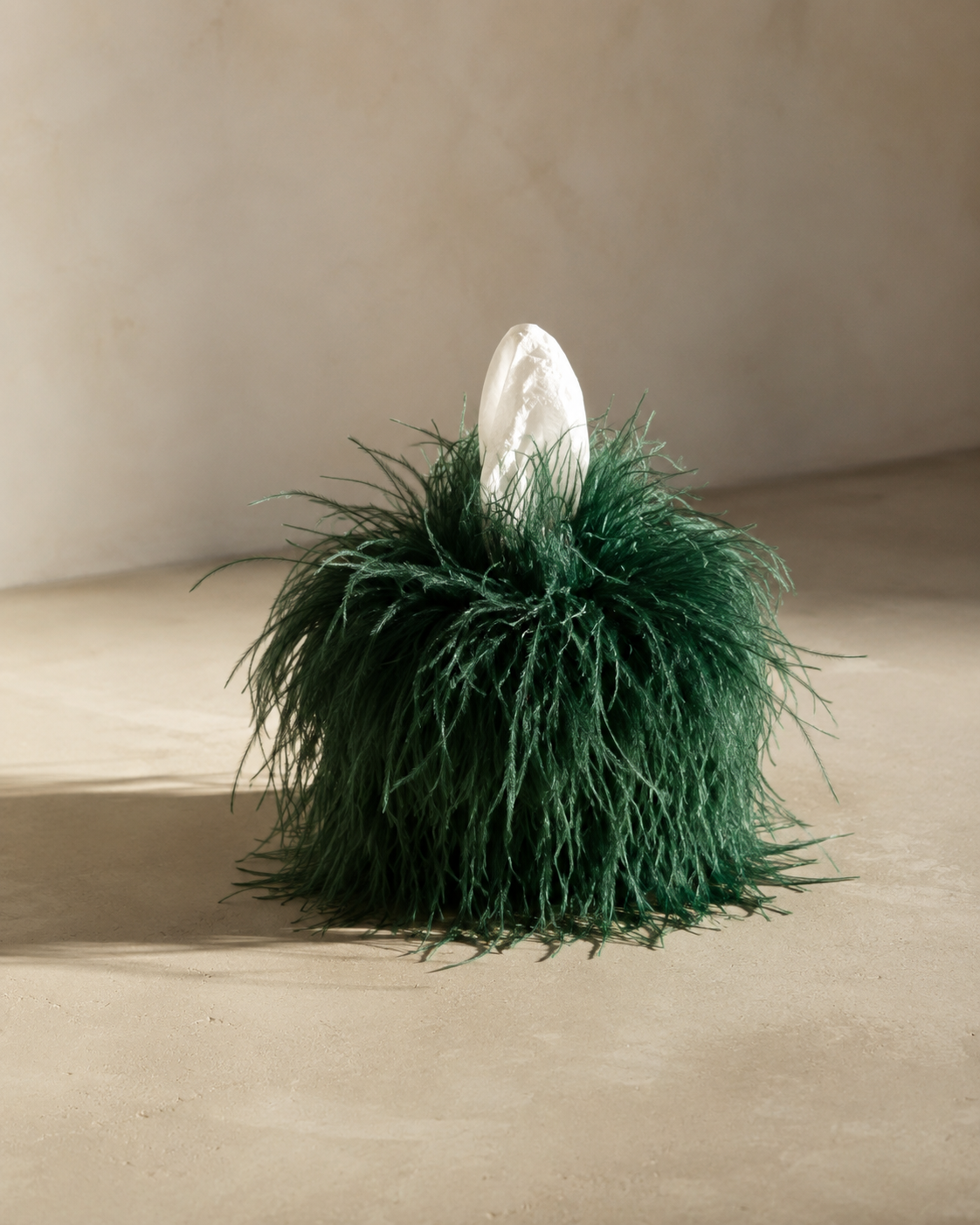 Viridian ostrich feather tissue box cover handcrafted with genuine green ostrich feathers in a minimalist editorial setting.