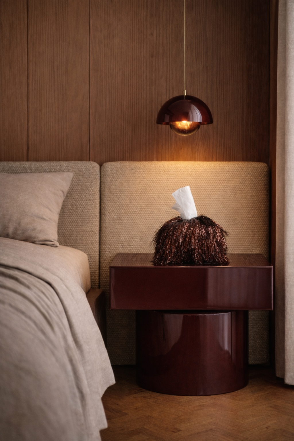 Burnt mahogany static tinsel fringe tissue box cover with reflective layered texture in a warm luxury interior