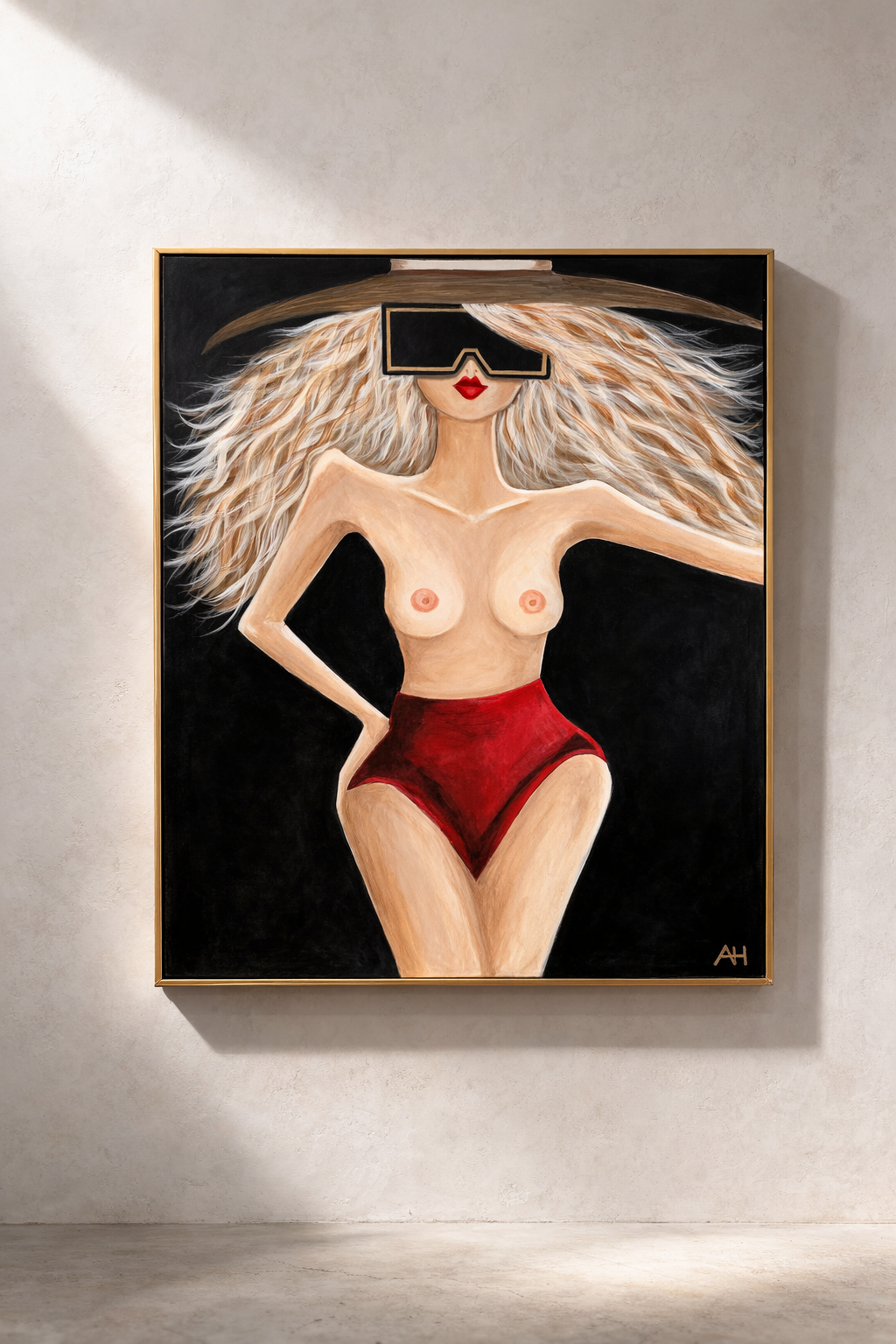 Mixed media artwork of a stylized female figure with flowing hair, wearing sculptural tassel adornments, framed in a metallic frame—The Female Edit by Amber Renee Hansen.