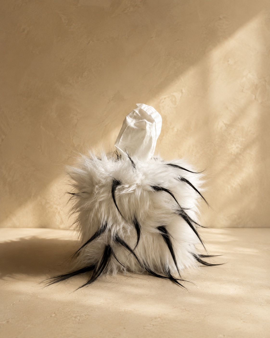 Quiet Thorn faux fur tissue box cover styled with fibers worked upward for a messy, sculptural texture by Amber Renee Hansen.