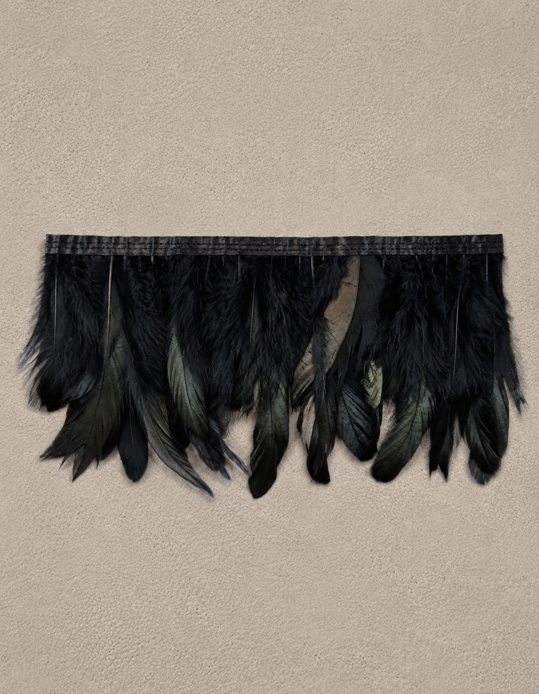 Midnight Feather Tissue Box Cover wrapped in genuine black feathers with subtle iridescent sheen.