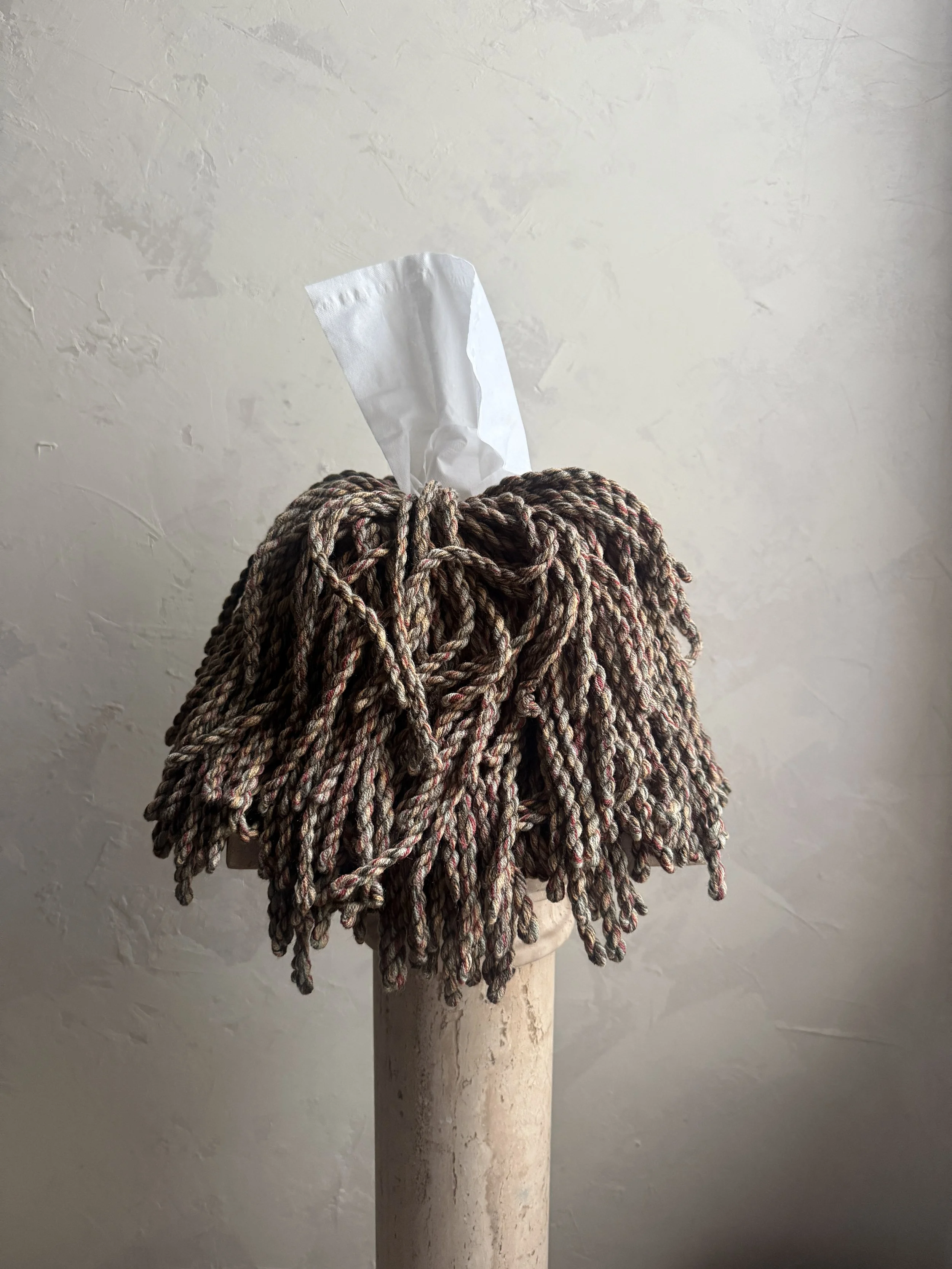 Meadow Knit Blend fringe tissue box cover wrapped in a green, merlot, sky-blue, and cream yarn blend — sculptural, textural, and handmade by Amber Renee Hansen.