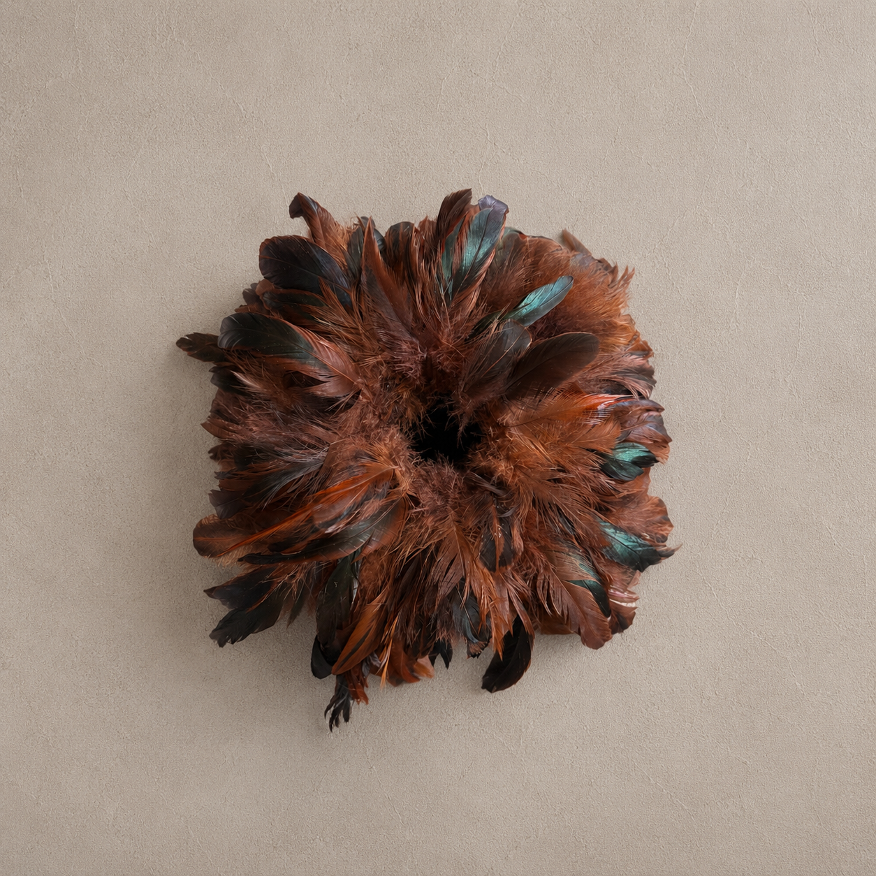 Overhead view of Chestnut Tobacco feather tissue box cover displaying layered feather pattern and dimensional texture.