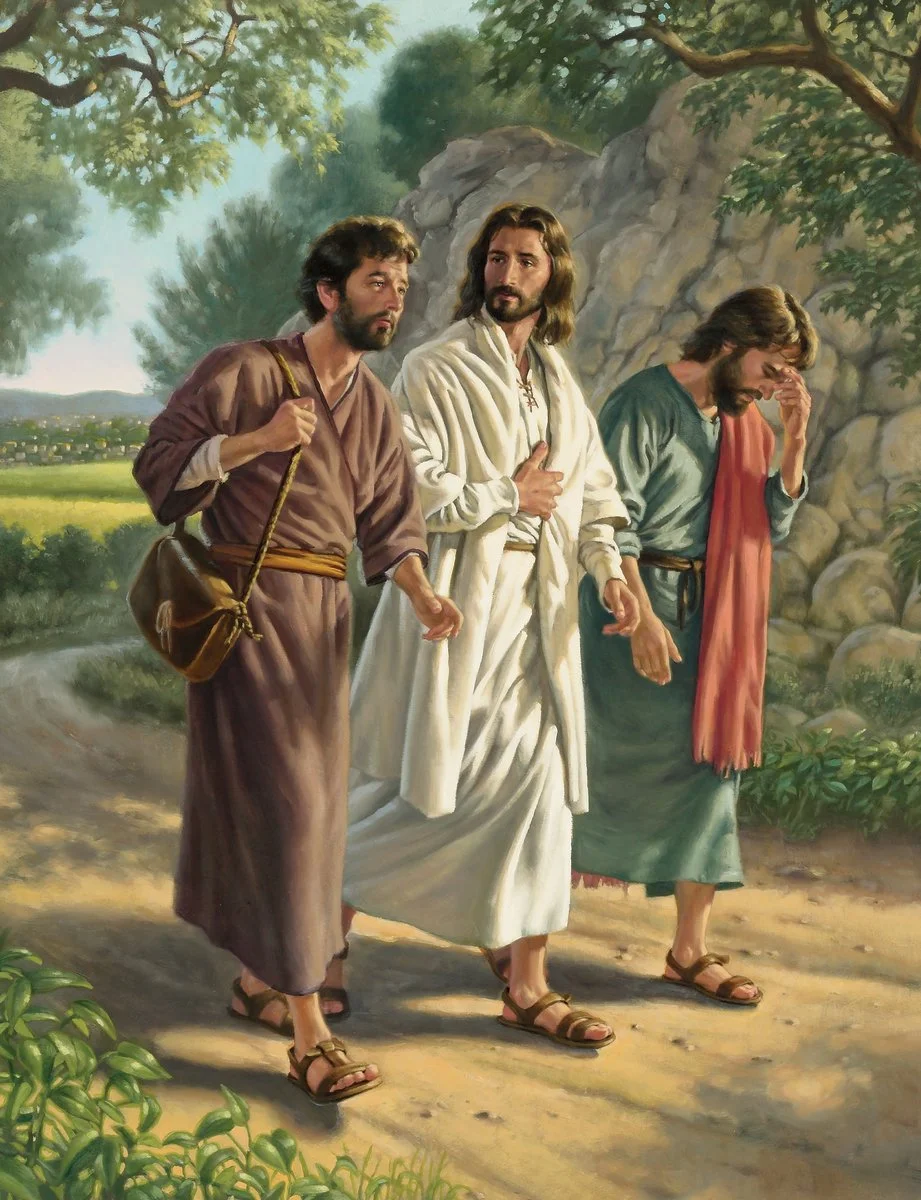 Jesus walking with two disciples on the road to Emmaus.