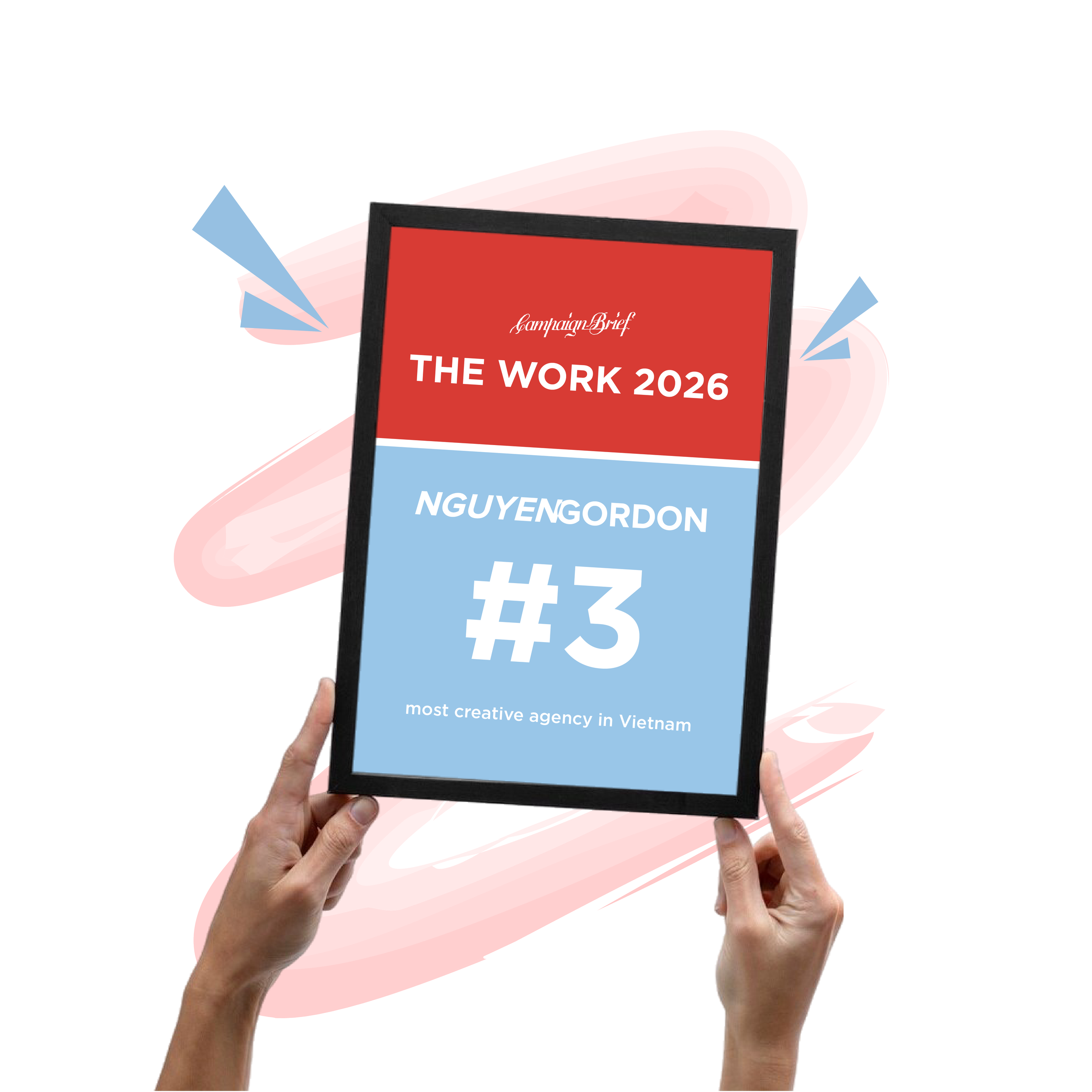 Hands holding a tablet displaying a red banner with white text that reads 'Campaign Brief THE WORK 2026 NGUYEN GORDON' and smaller text underneath, set against a pink abstract background with arrows.