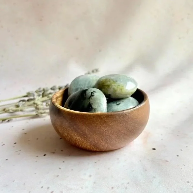 Natural Labradorite palm stone with an average weight of approximately 41 grams