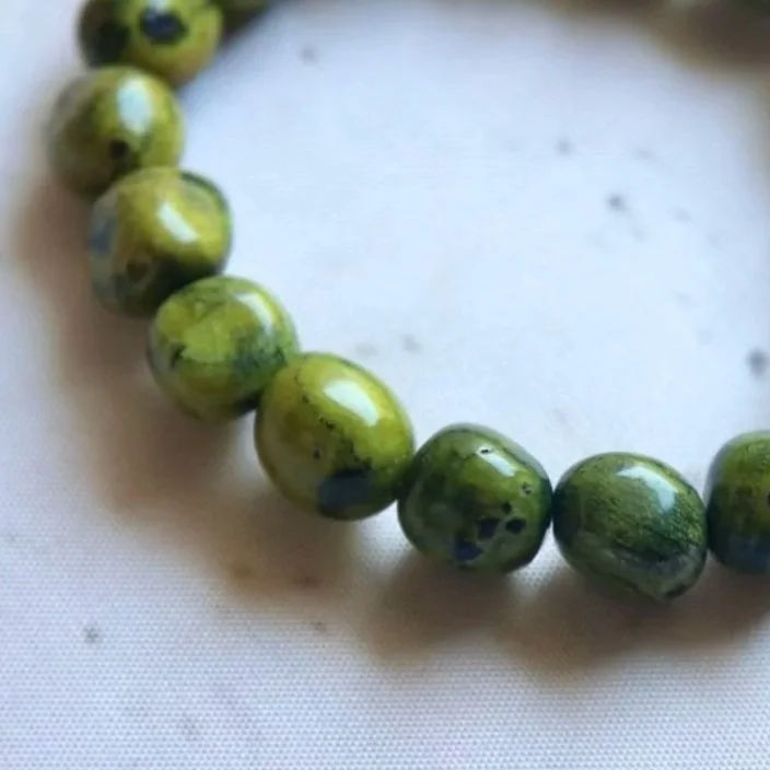 Natural Australian Atlantisite crystal bracelet with irregular tumble beads in green and purple tones