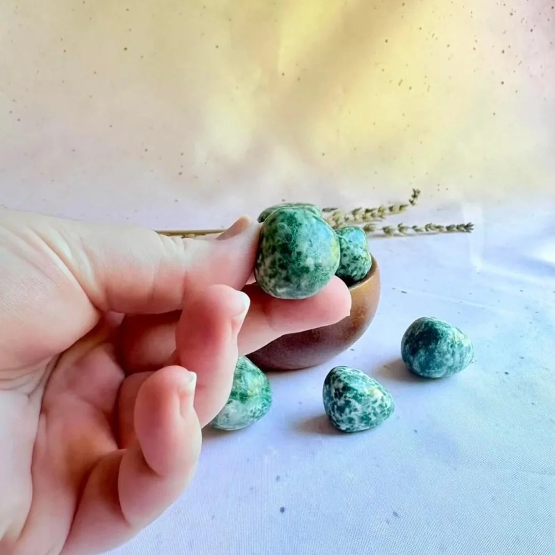 Polished Nan King Jade crystal tumble displaying natural green colouring