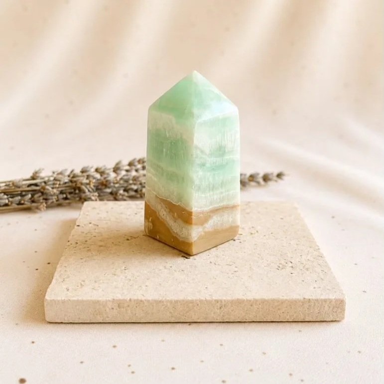 Caribbean Calcite crystal tower featuring ocean-inspired colours and natural banding, measuring approximately 7cm tall